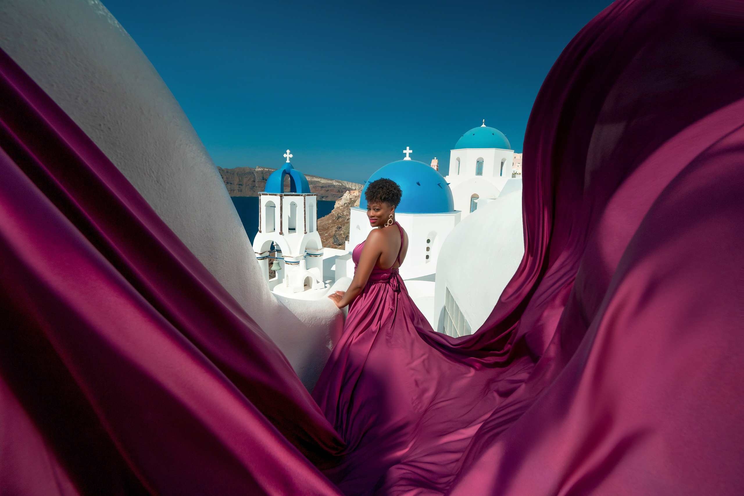 One of the group participants group photoshooting in Santorini. Photographer in Santorini SokoLOVE Alex| Flying Dress Santorini