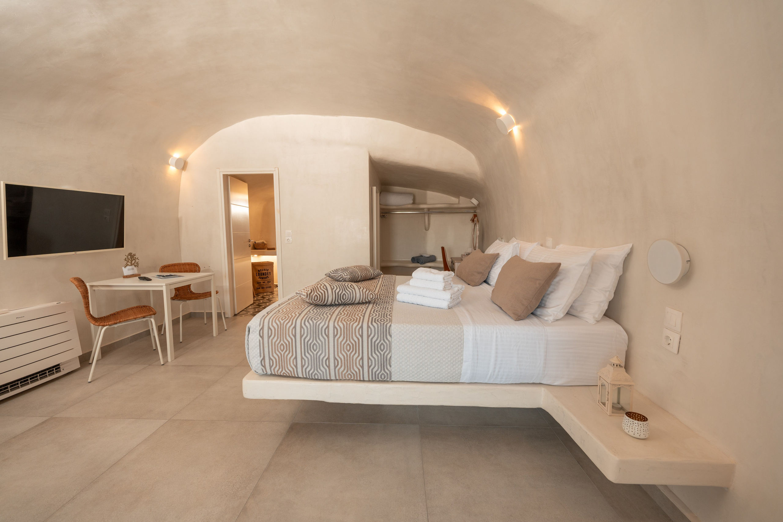 Hotel caves in Oia. Flying Dress Santorini Photographer | SokoLOVE — Book 2026