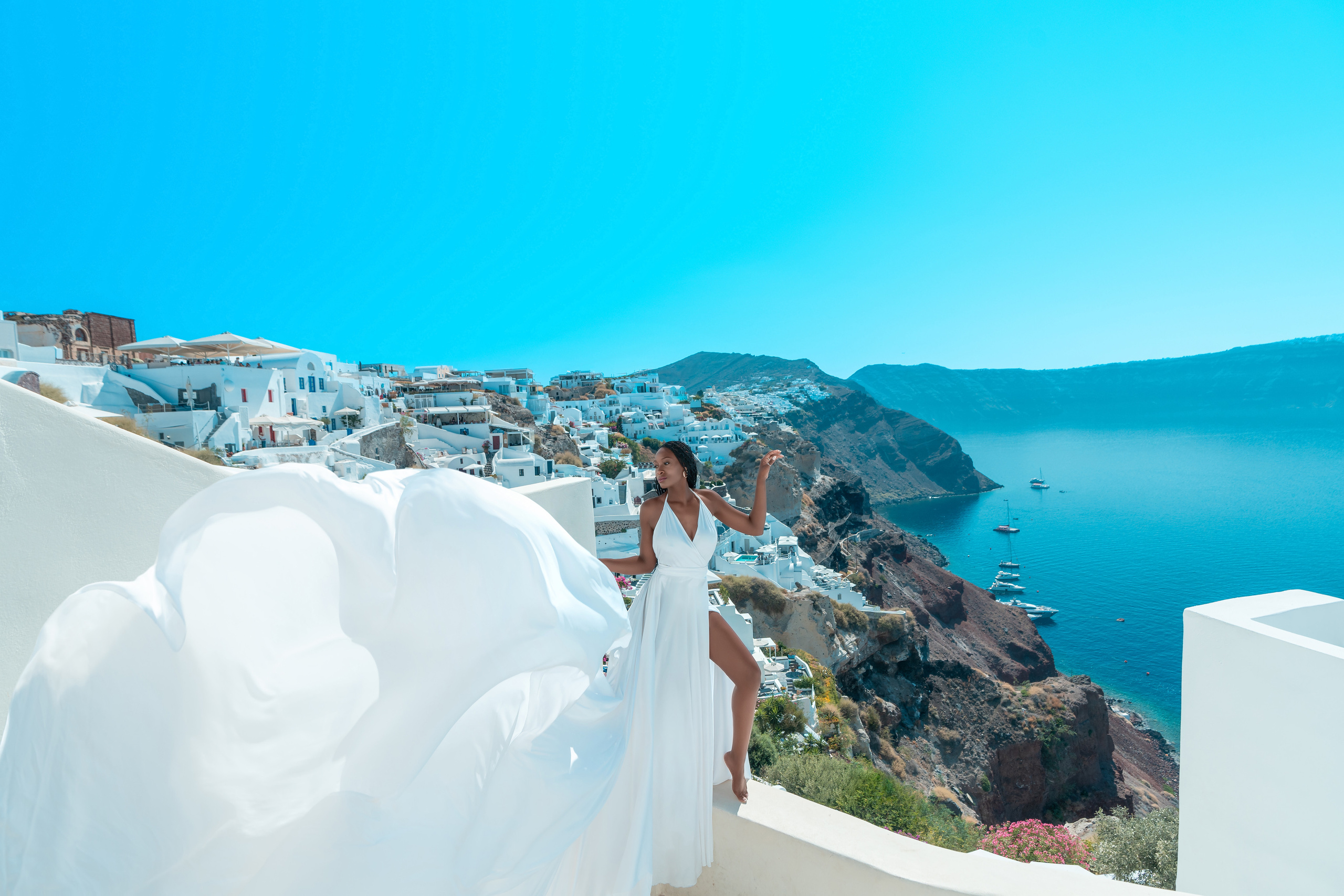 White Flying Dress | V-Back | Sizes XS-L – Elegant & Flowing. Photographer in Santorini SokoLOVE Alex| Flying Dress Santorini