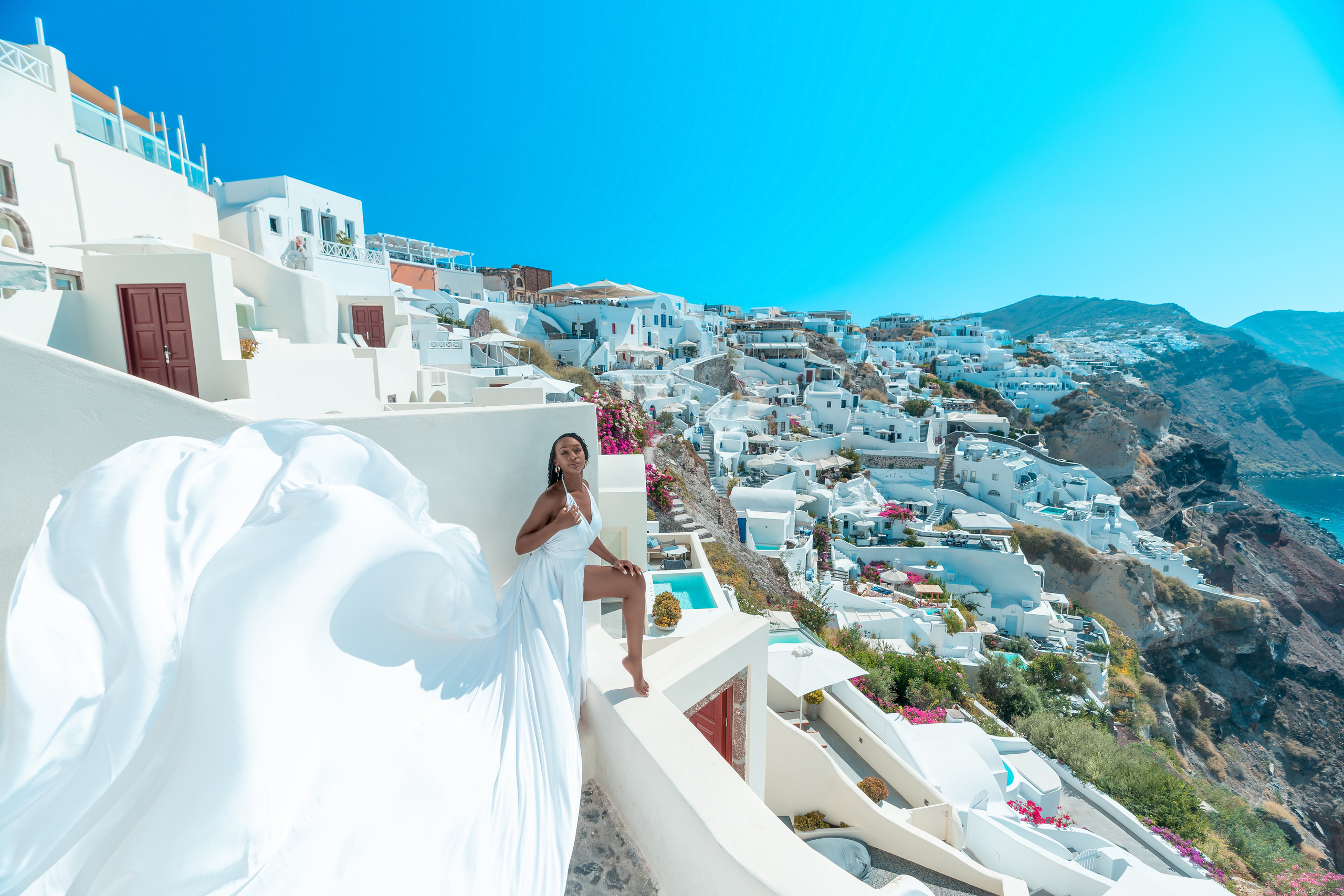 White Flying Dress | V-Back | Sizes XS-L – Elegant & Flowing. Photographer in Santorini SokoLOVE Alex| Flying Dress Santorini