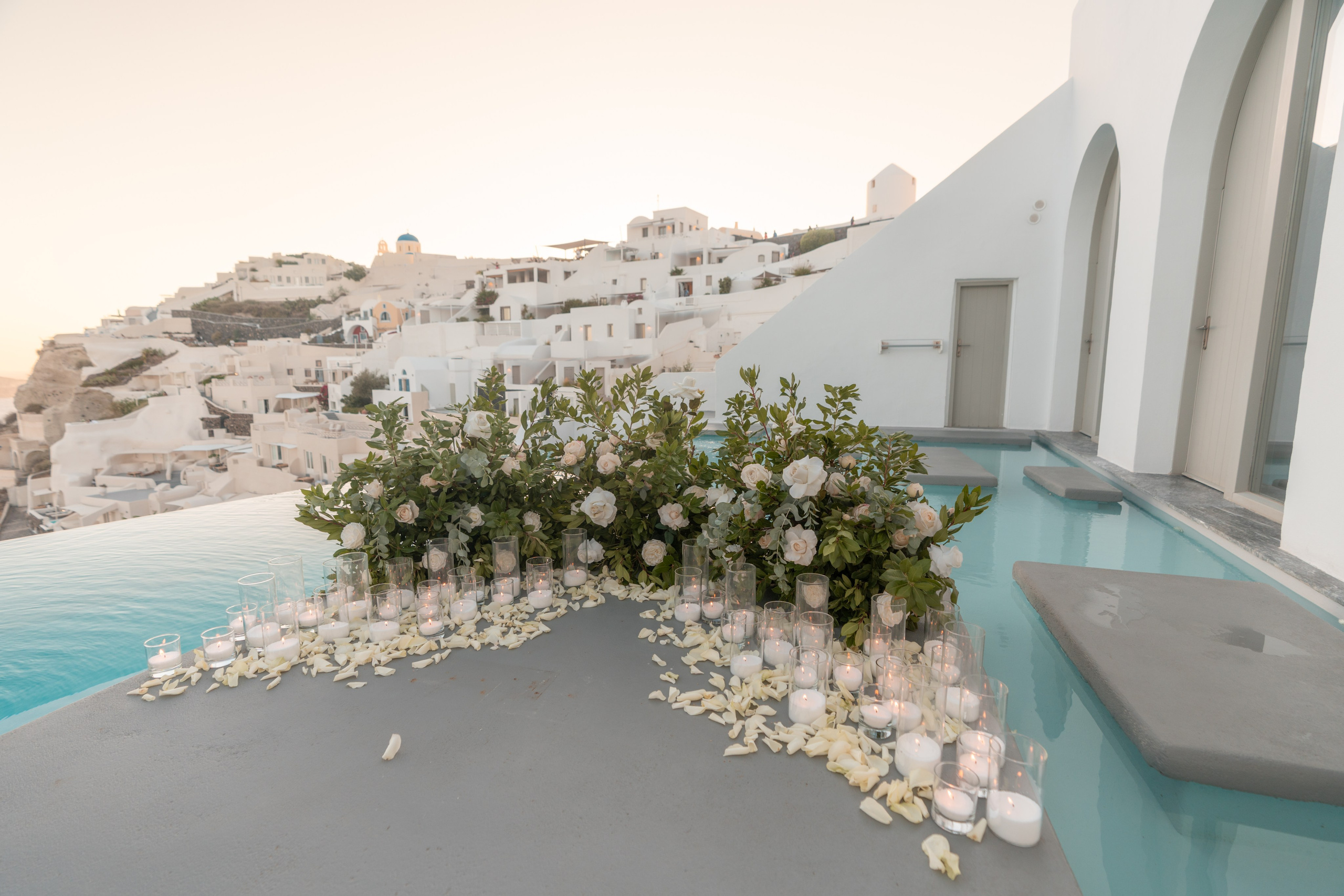 Magical Floral Decor Ideas for Secret Marriage Proposals in Stunning Santorini Venues. Photographer in Santorini SokoLOVE Alex| Flying Dress Santorini