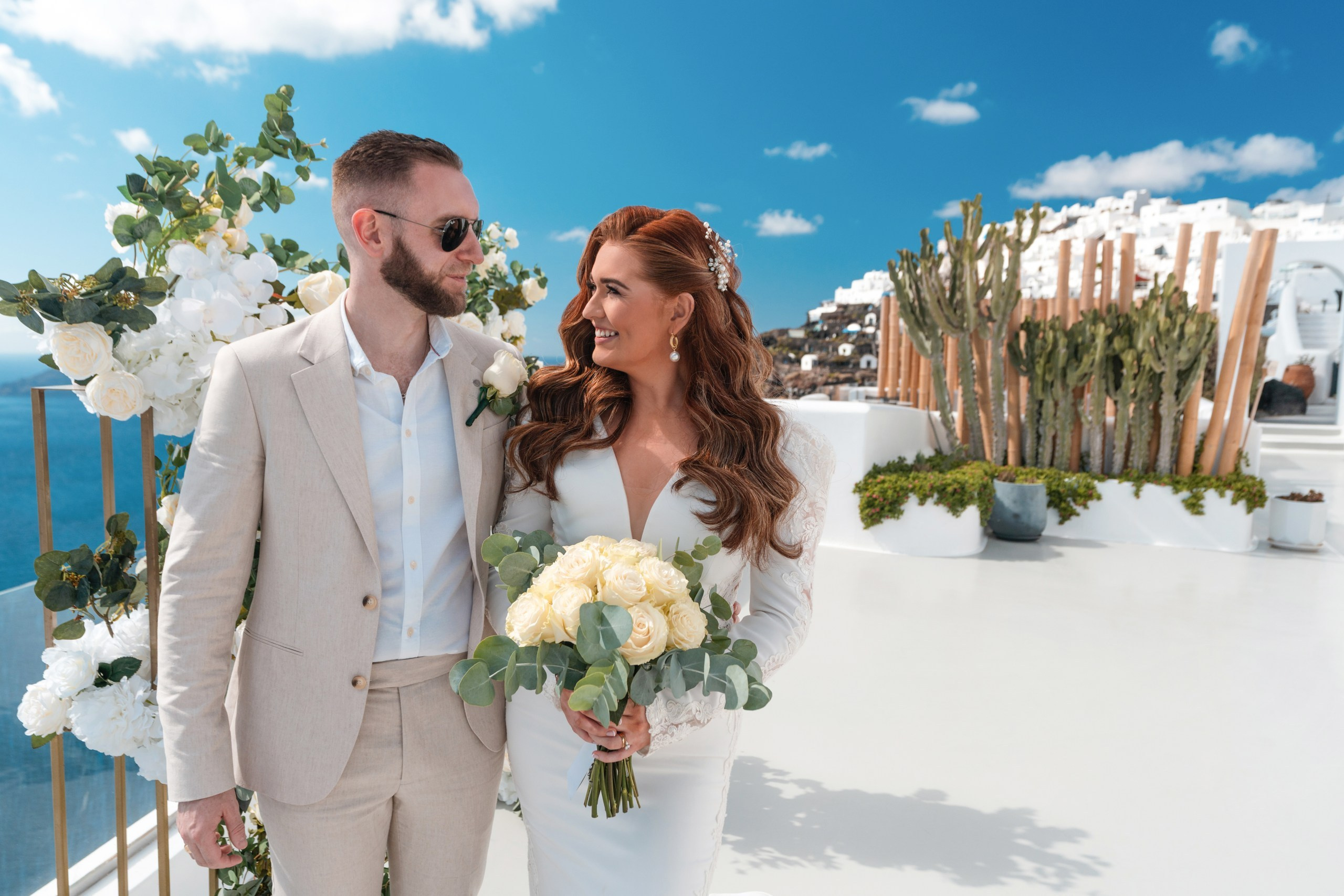 Wedding photo shoot in Imerovigli. Flying Dress Santorini Photographer | SokoLOVE — Book 2026