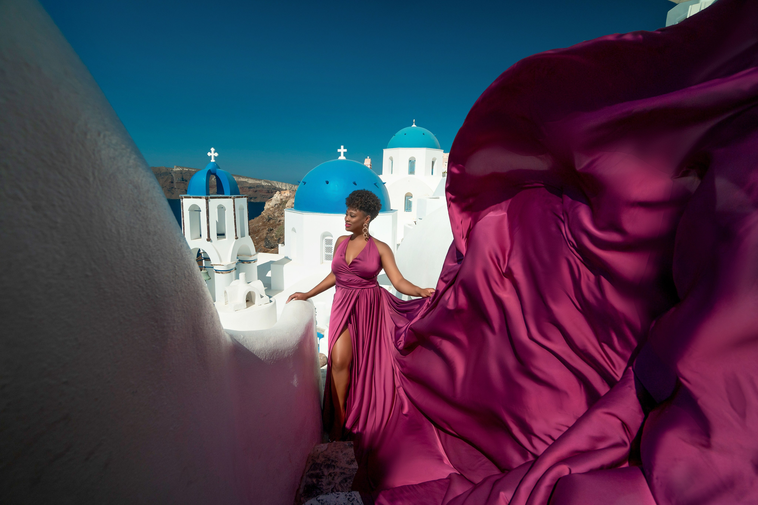 One of the group participants group photoshooting in Santorini. Photographer in Santorini SokoLOVE Alex| Flying Dress Santorini