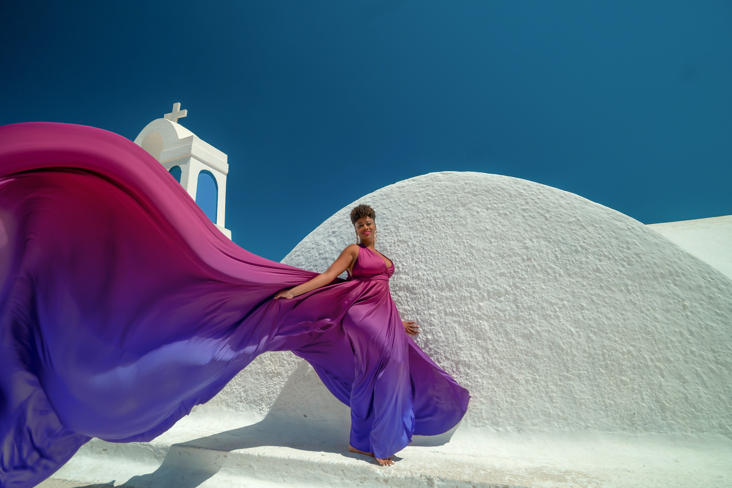 One of the group participants group photoshooting in Santorini. Photographer in Santorini SokoLOVE Alex| Flying Dress Santorini