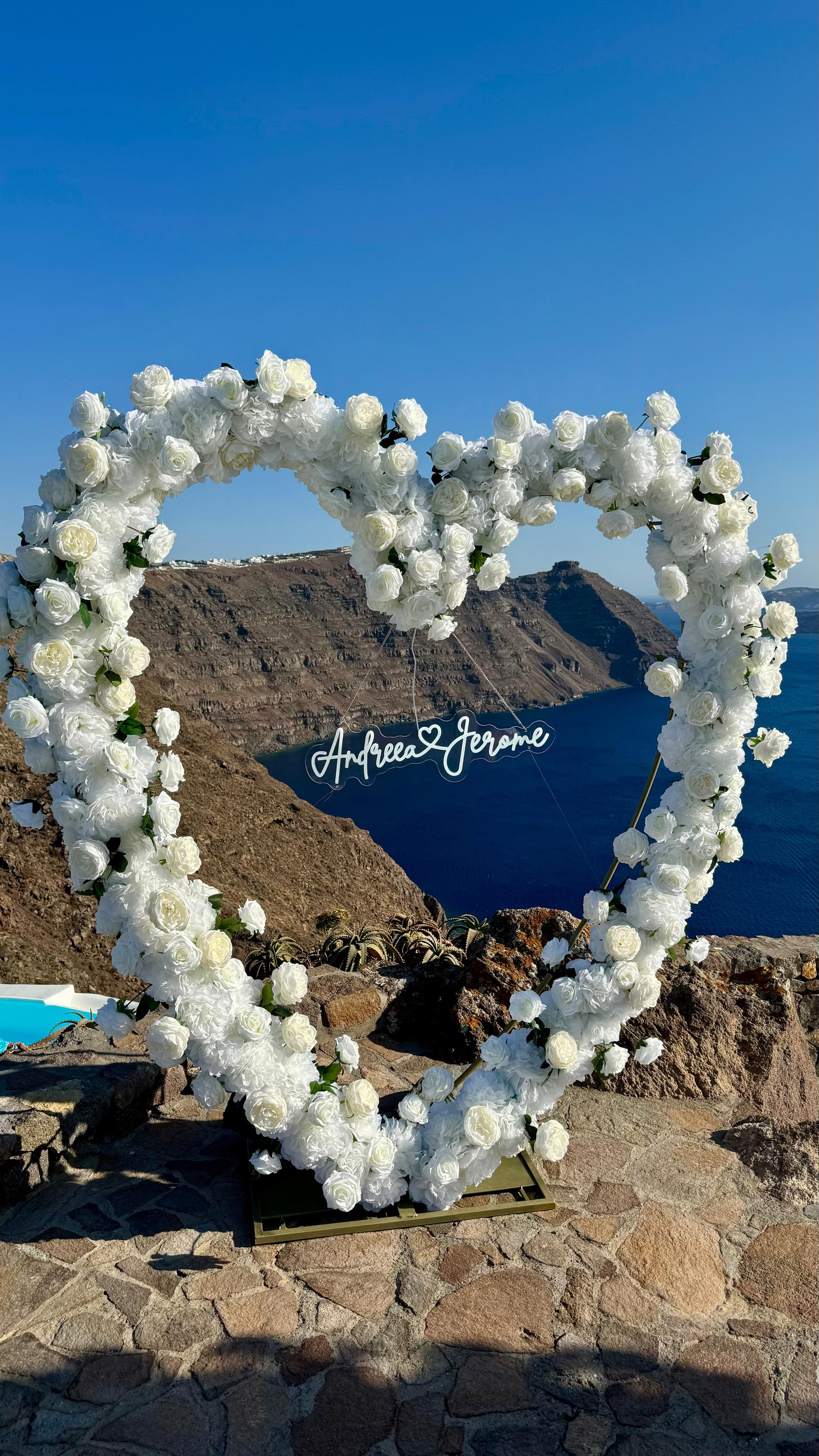 Magical Floral Decor Ideas for Secret Marriage Proposals in Stunning Santorini Venues. Photographer in Santorini SokoLOVE Alex| Flying Dress Santorini