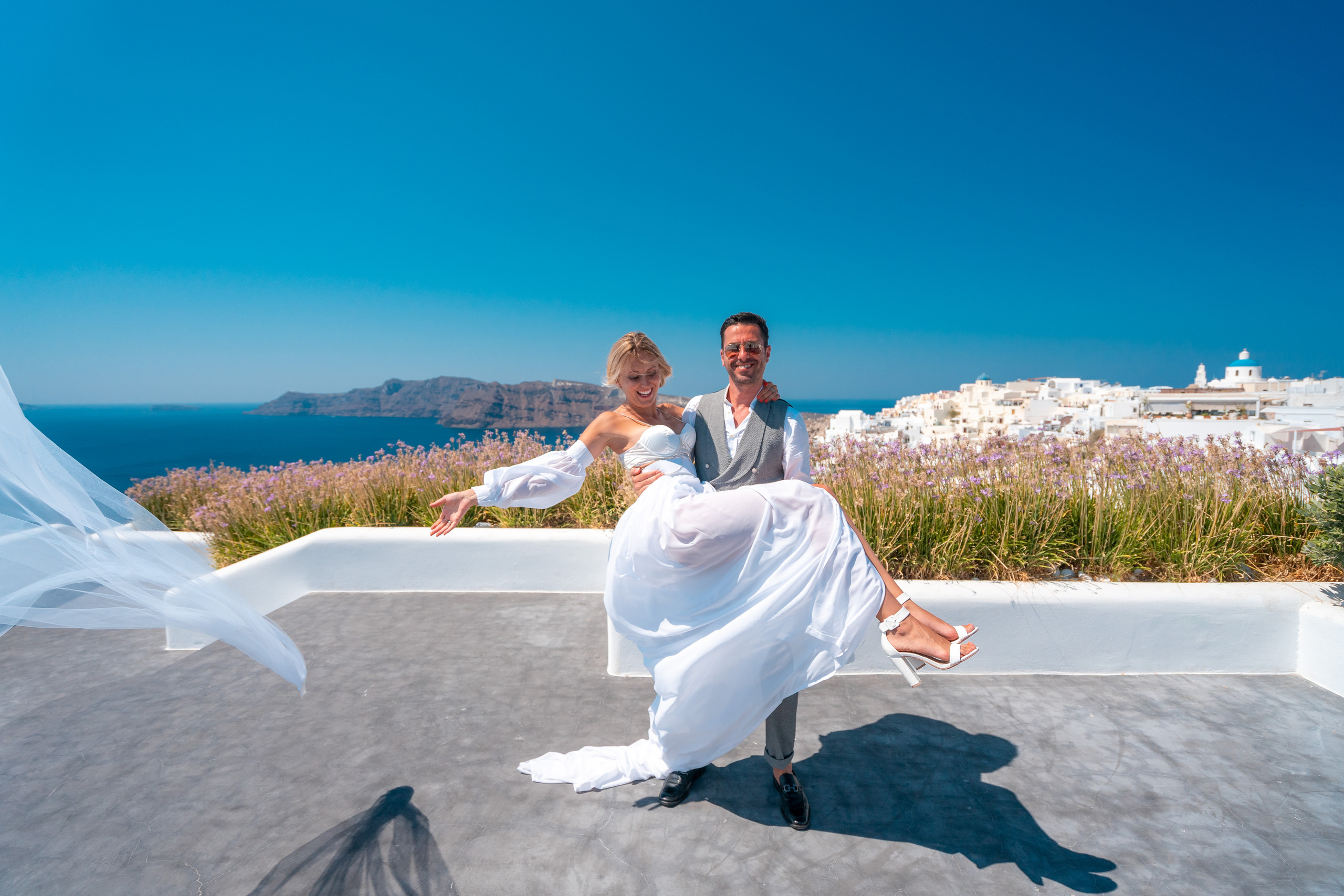 Wedding photographer in Santorini. Photographer in Santorini SokoLOVE Alex| Flying Dress Santorini