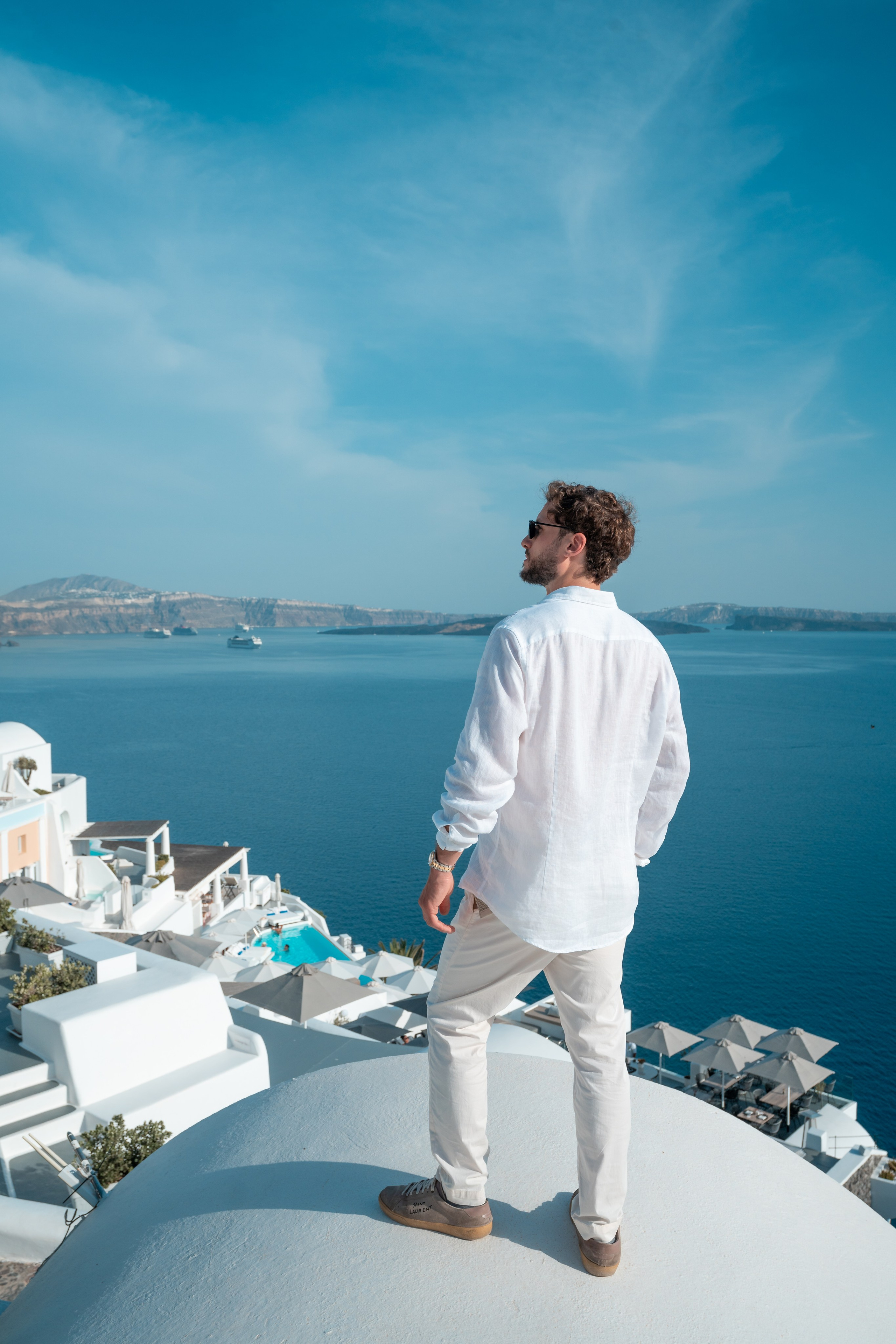Capture your sophisticated side with a Santorini men’s portrait photoshoot by Sokolove. Our expert photographers will frame your elegance against the island’s breathtaking views, creating timeless and powerful images