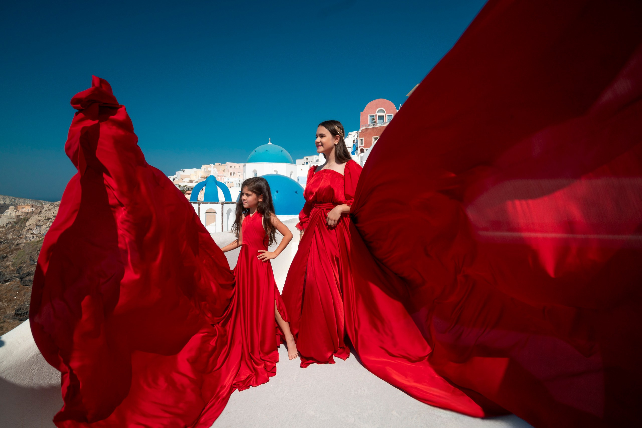 Family Photography in Oia with Flowing Dresses | Stunning Santorini Shoots. Photographer in Santorini SokoLOVE Alex| Flying Dress Santorini