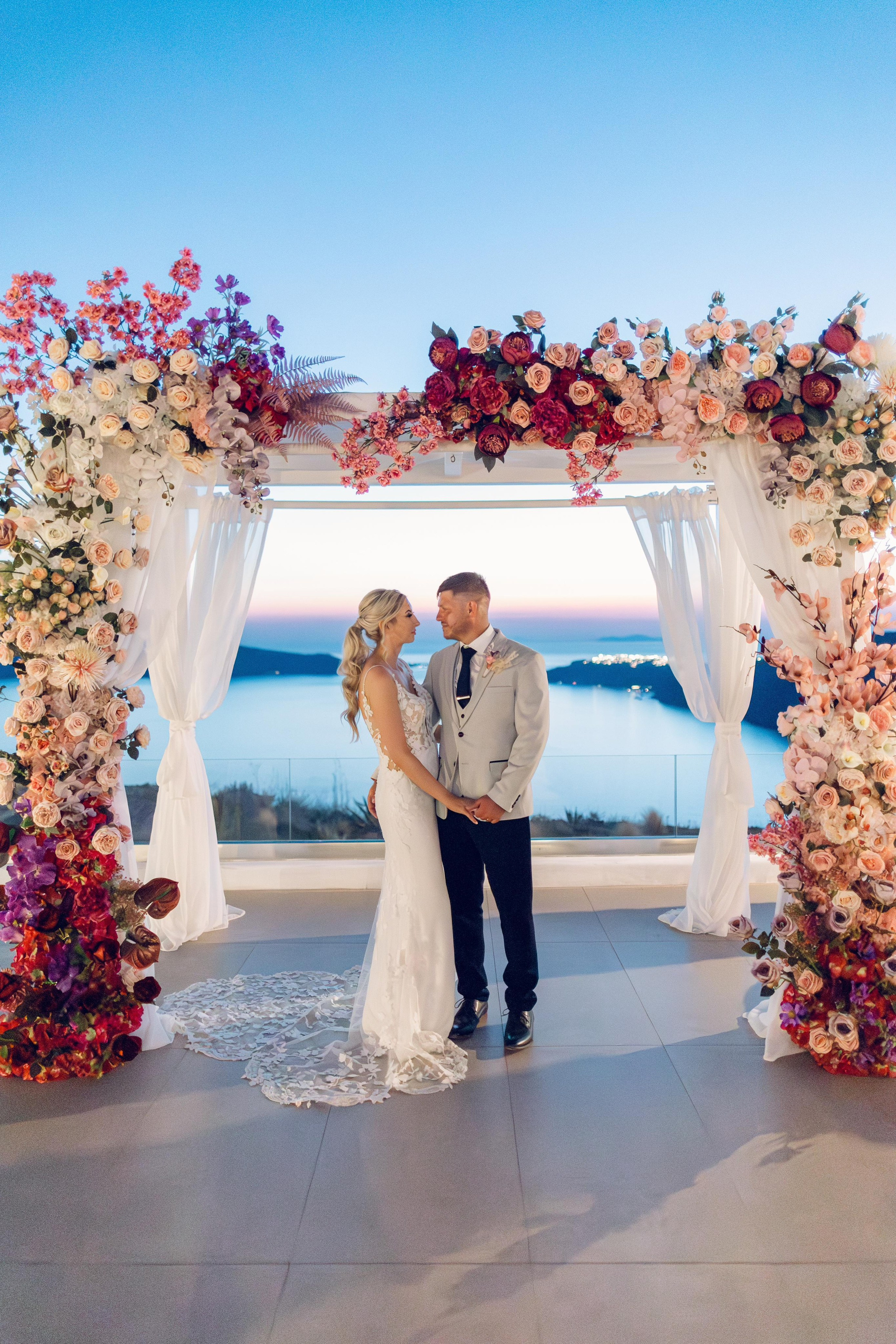 Magical Floral Decor Ideas for Secret Marriage Proposals in Stunning Santorini Venues. Photographer in Santorini SokoLOVE Alex| Flying Dress Santorini