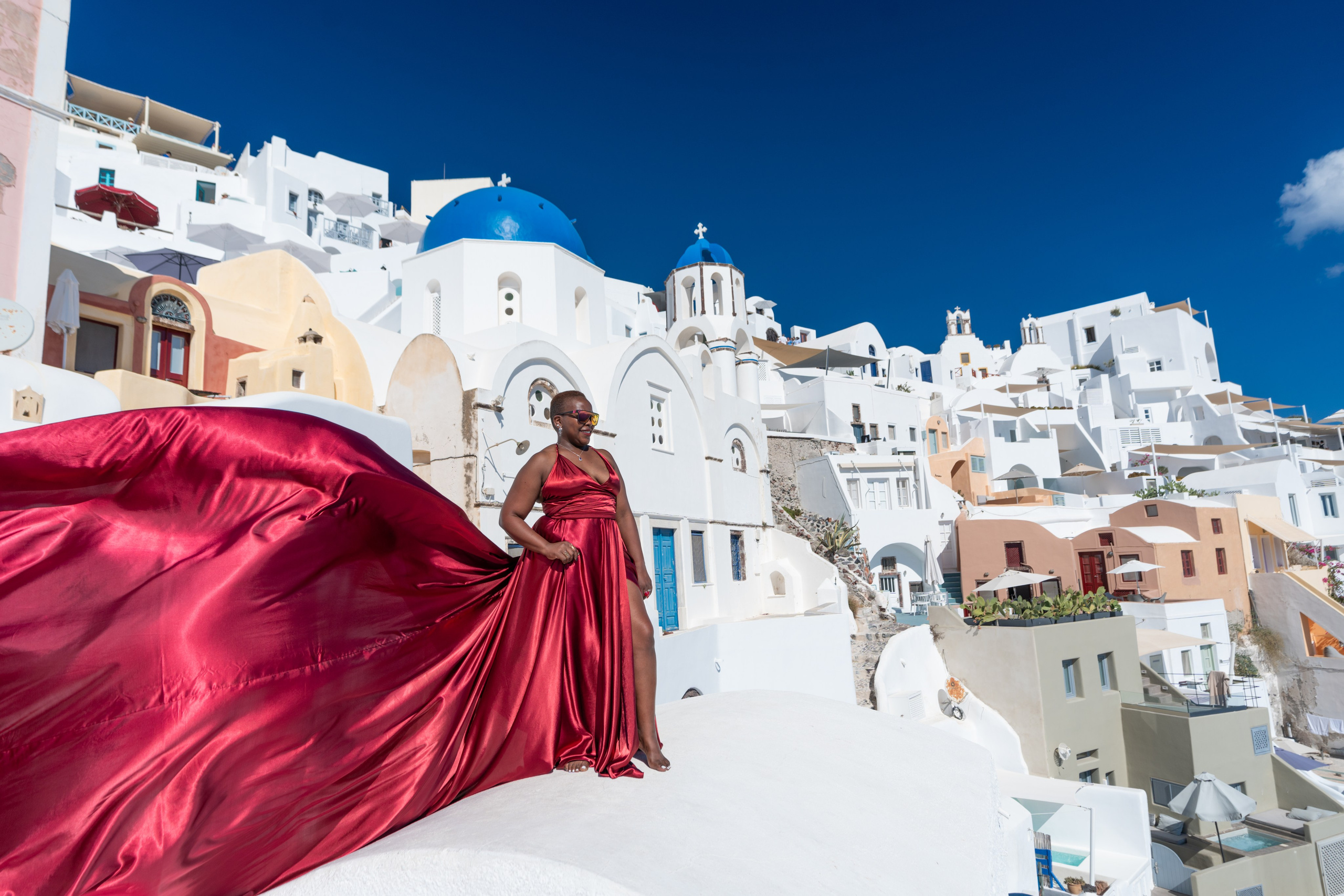Red Wine Satin Flying Dress with V-Shaped Back in Santorini by Sokolove | Plus Size L-XXXL"Turn your Santorini photoshoot into a masterpiece with the chic Red Wine Satin Flying Dress, available for plus sizes L-XXXL. With its graceful V-shaped back, this elegant dress is perfect for capturing magical moments, photographed by Sokolove."