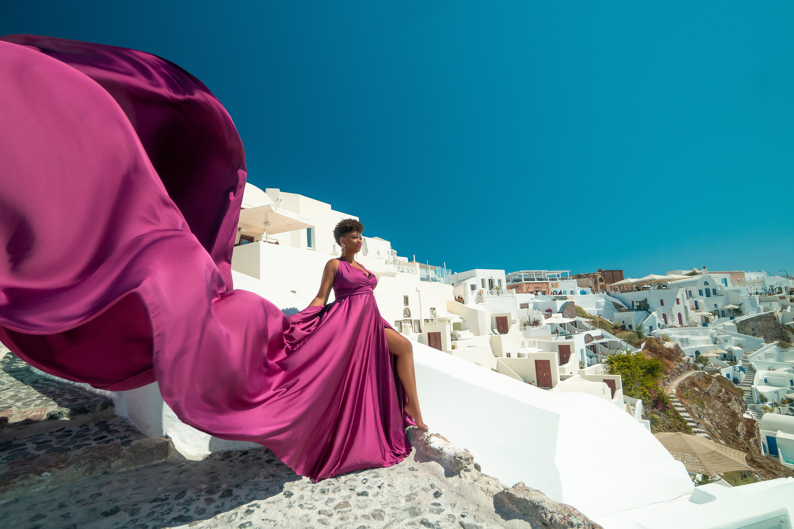 One of the group participants group photoshooting in Santorini. Photographer in Santorini SokoLOVE Alex| Flying Dress Santorini