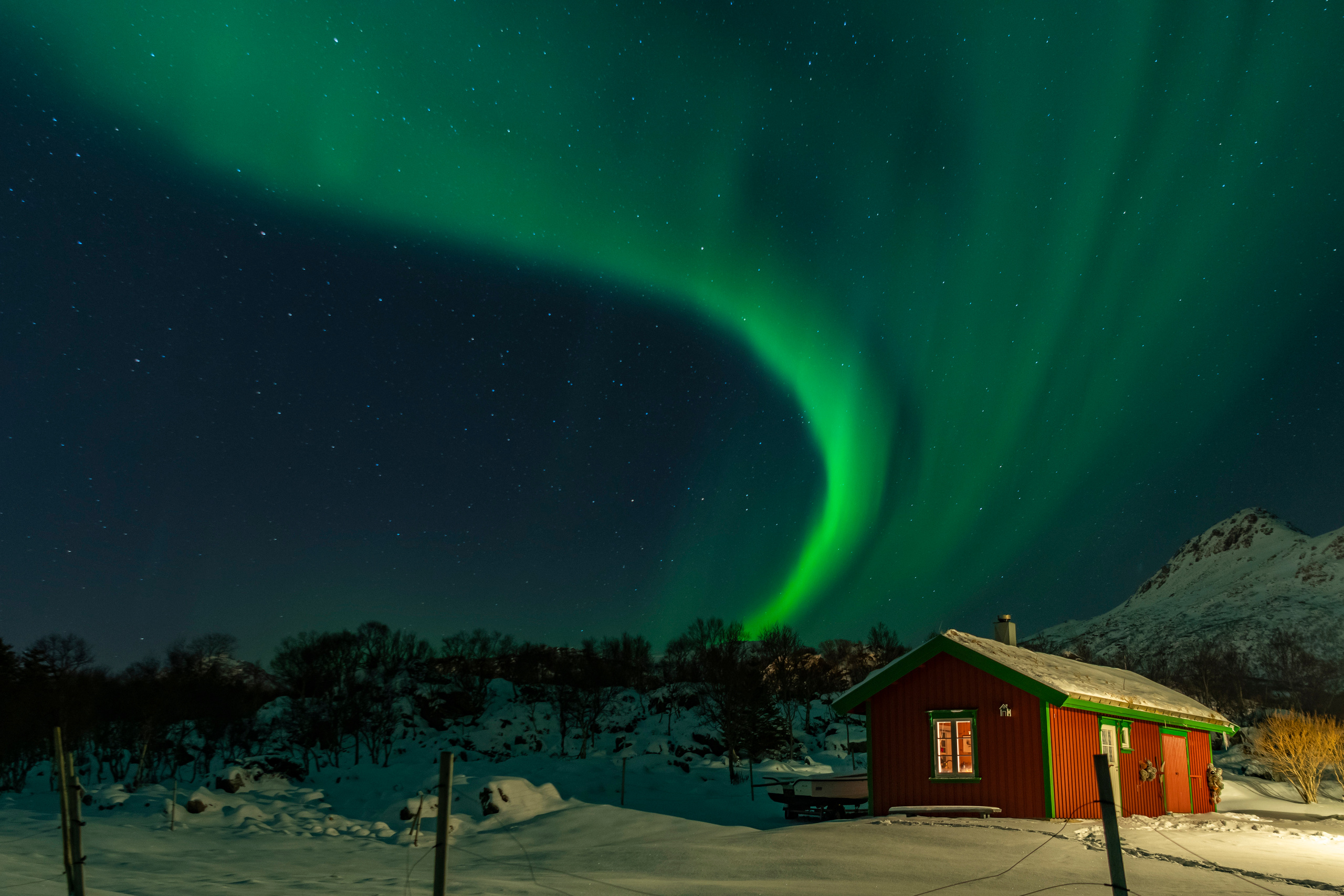The Northern Lights over the old and beautiful fisherman's house. Aurora Borealis over the old and beautiful fisherman's house.