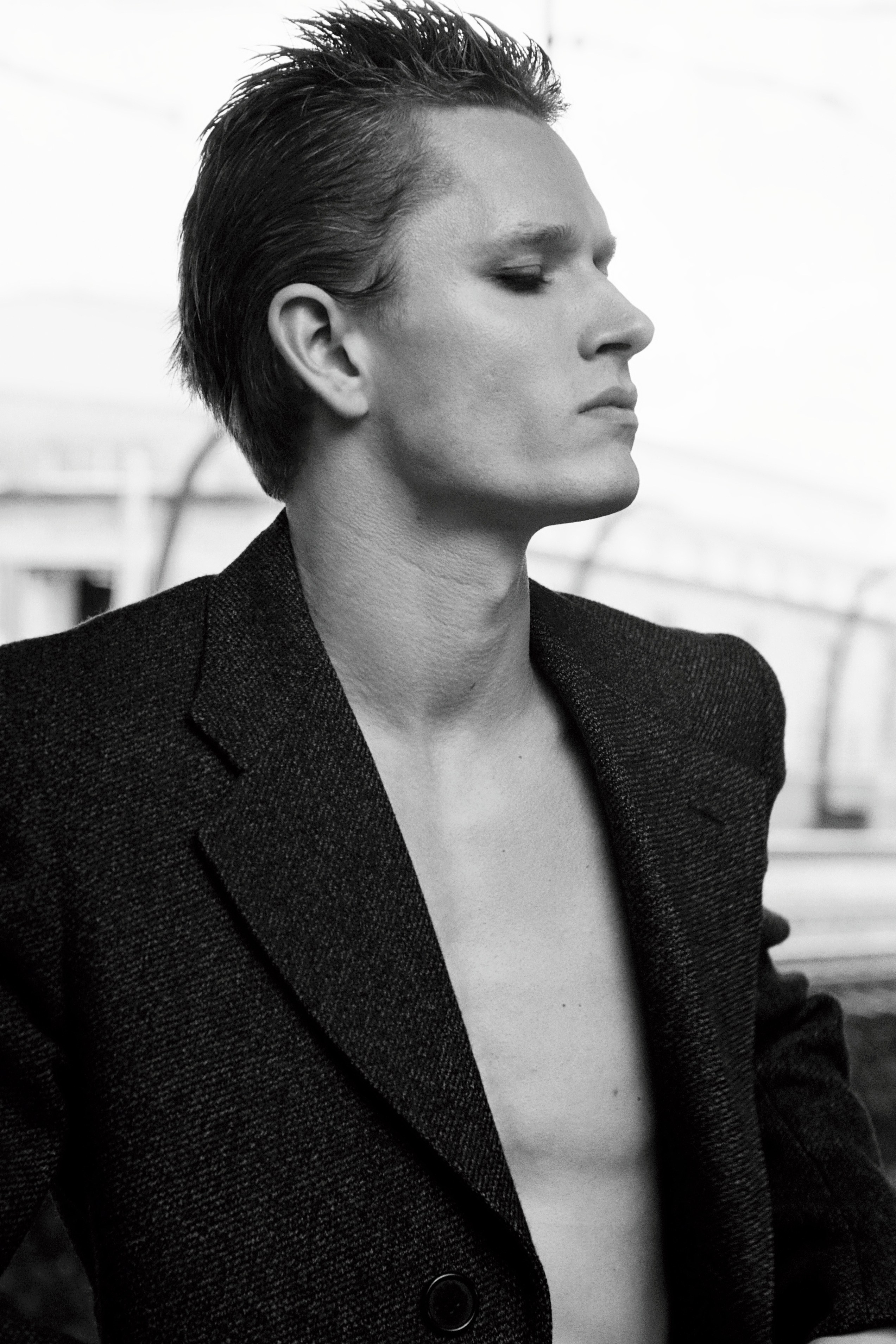 Styled fashion editorial portrait using vintage 35mm film stock, studio setting in Tallinn, Estonia