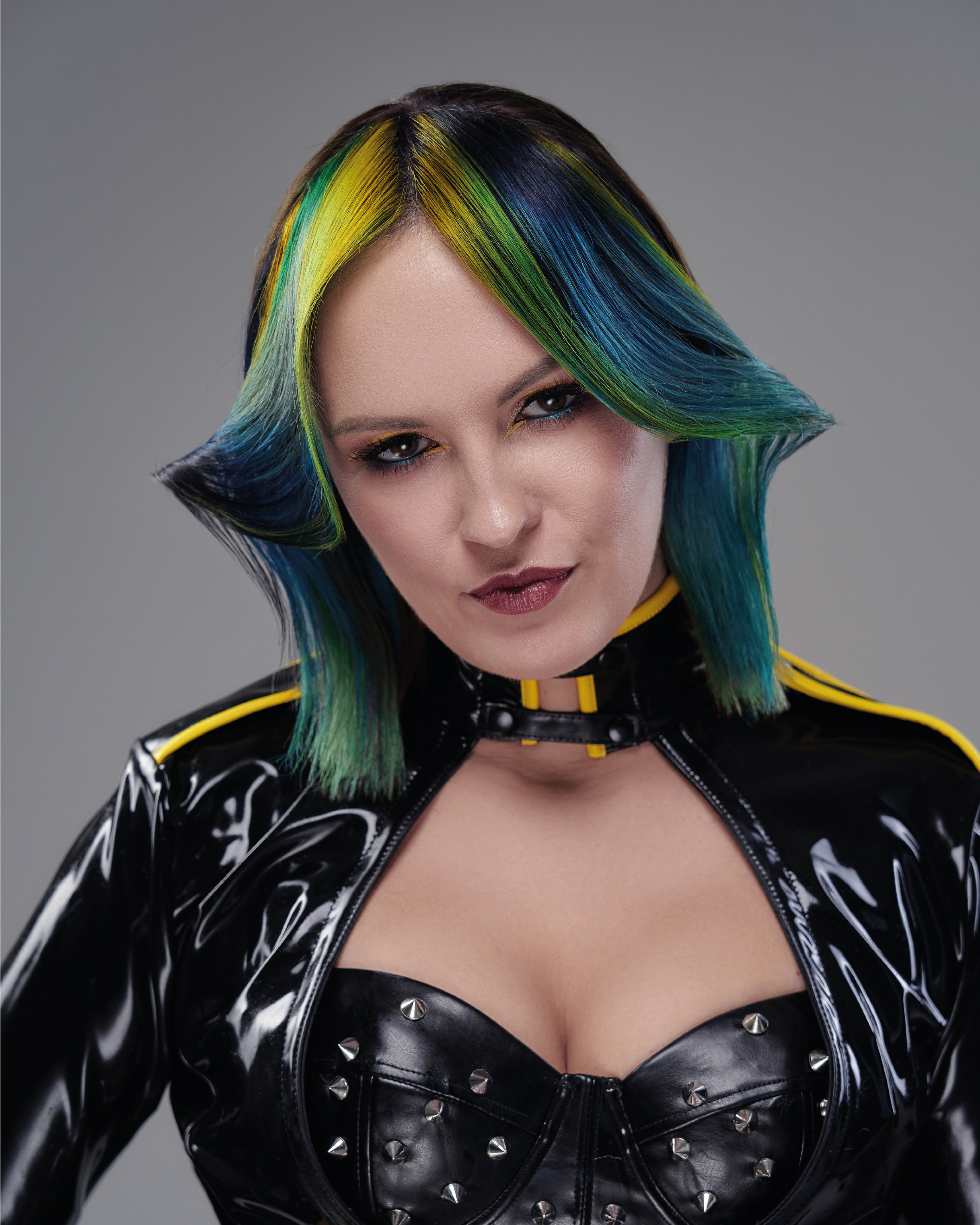 woman model with colourful hair in black leather jacket