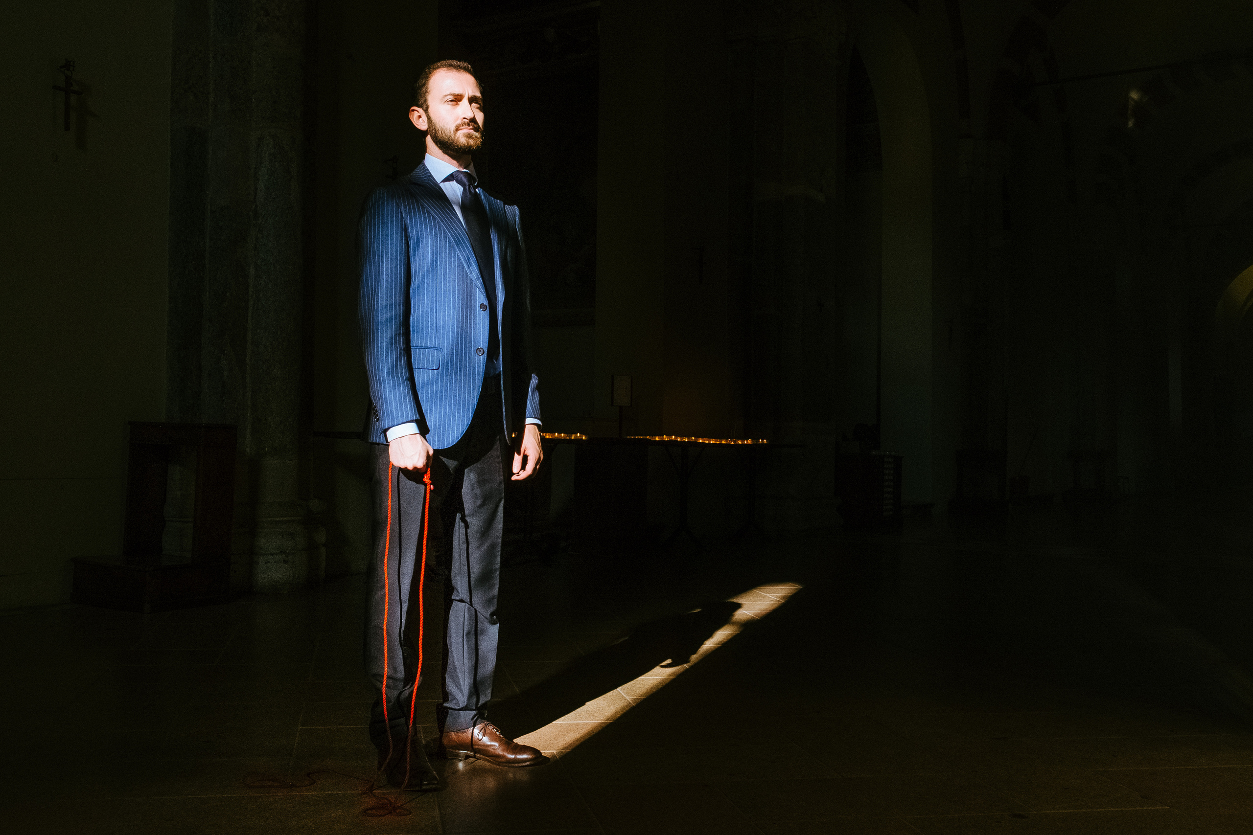 Andrea, 30 years old, ItalyIn Basilica di Sant’Ambrogio, MilanIn my mind, the Basilica di Sant’Ambrogio is the heart of Milan. Red thread symbolizes my connection with the city.