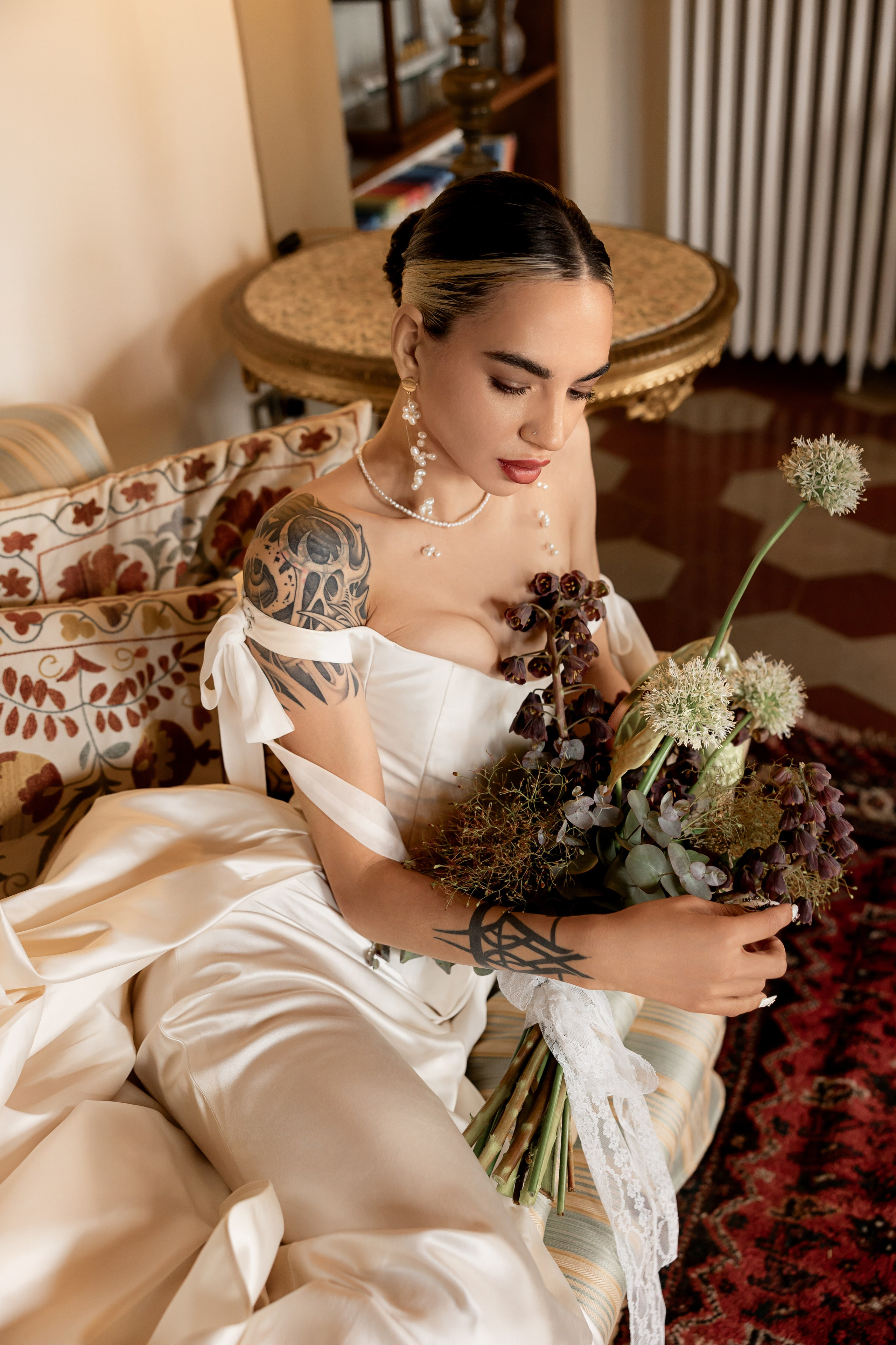 Wedding morning flat lay with jewelry, stationery and timeless bridal details.