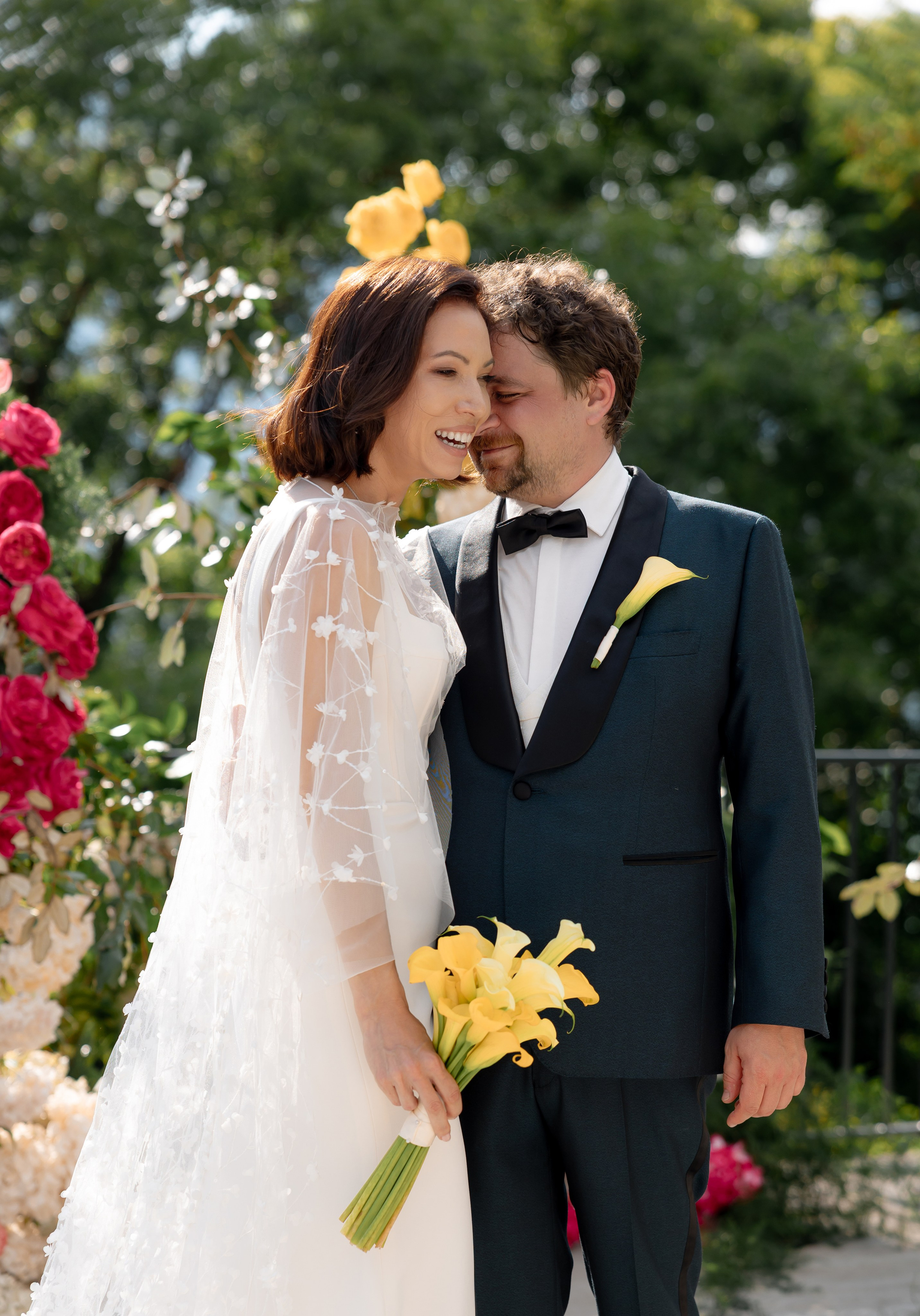 Editorial wedding portrait of bride and groom by pool at destination wedding