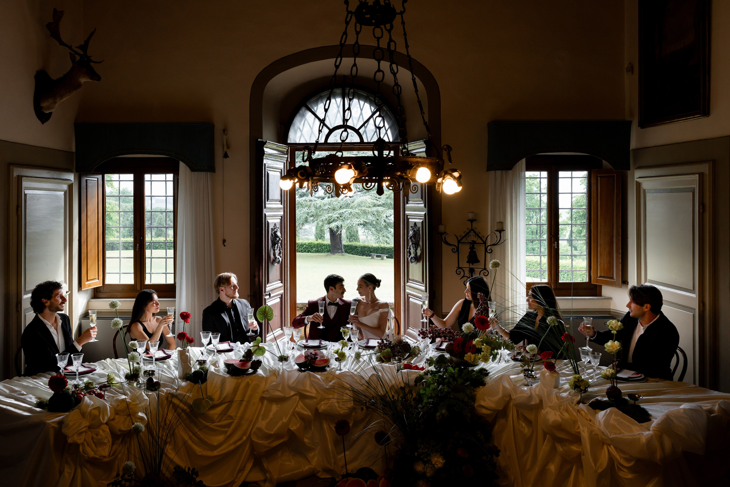 Elegant bride and groom in Tuscany surrounded by soft light and cinematic wedding scenery.