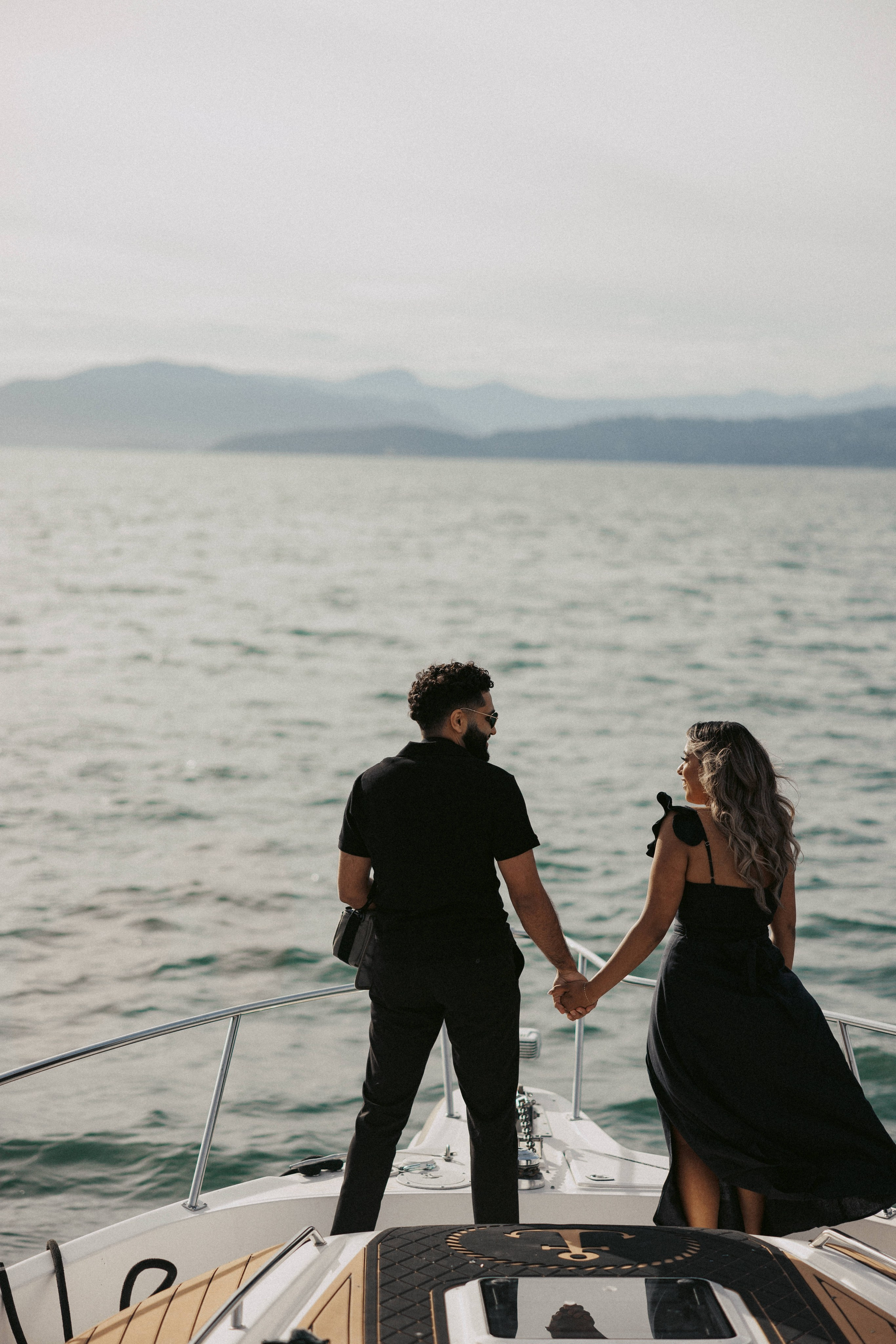 Beautiful marriage proposal on a luxury yacht in Vancouver with ocean view, captured by professional photographer.
