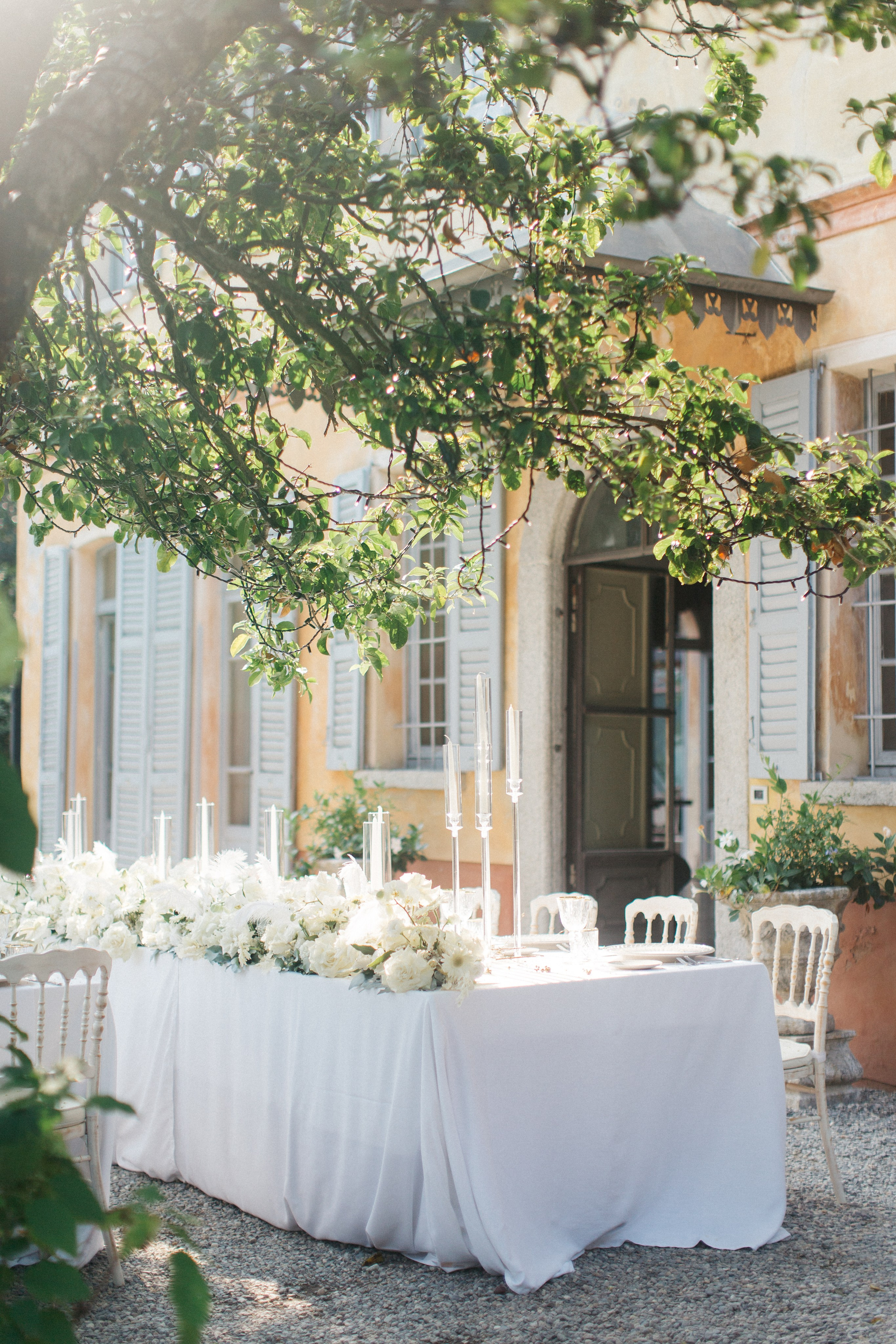 Elegant floral arrangement glowing in magical light at a wedding at Villa Regina Teodolinda, Lake Como
