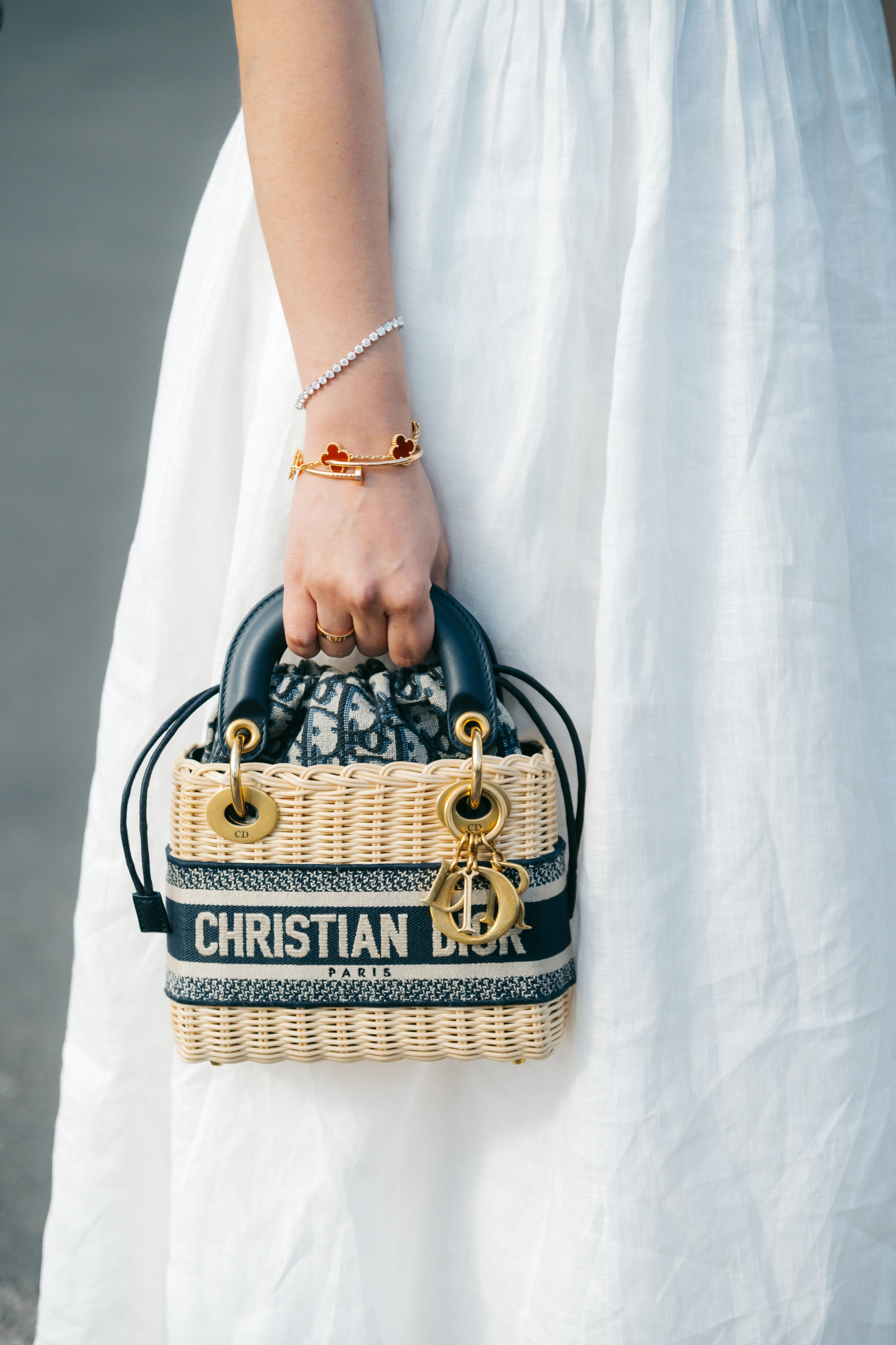 Bride showing her Dior bag as a stylish wedding accessory
