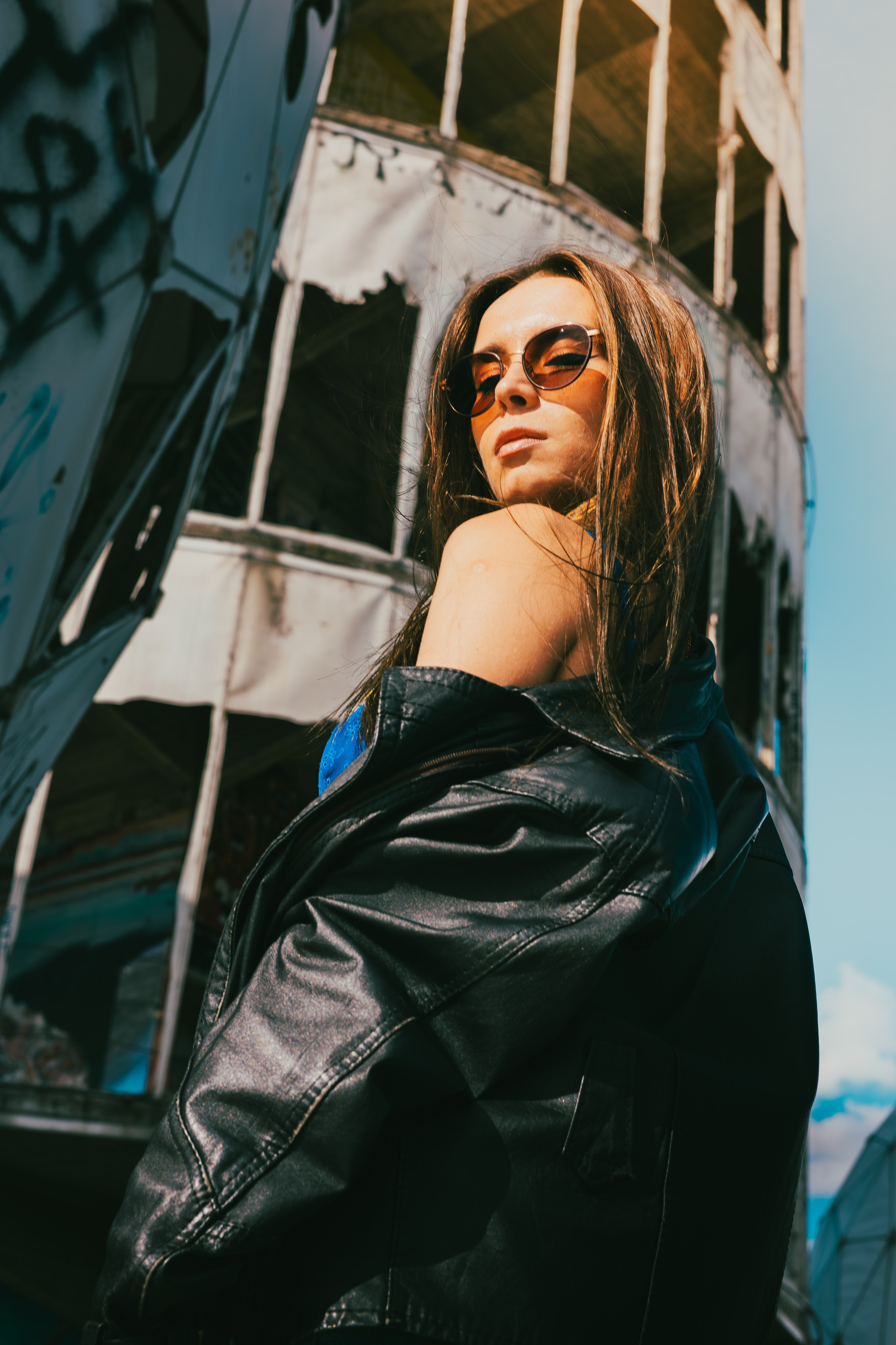 Woman standing among the abandoned structures of Teufelsberg