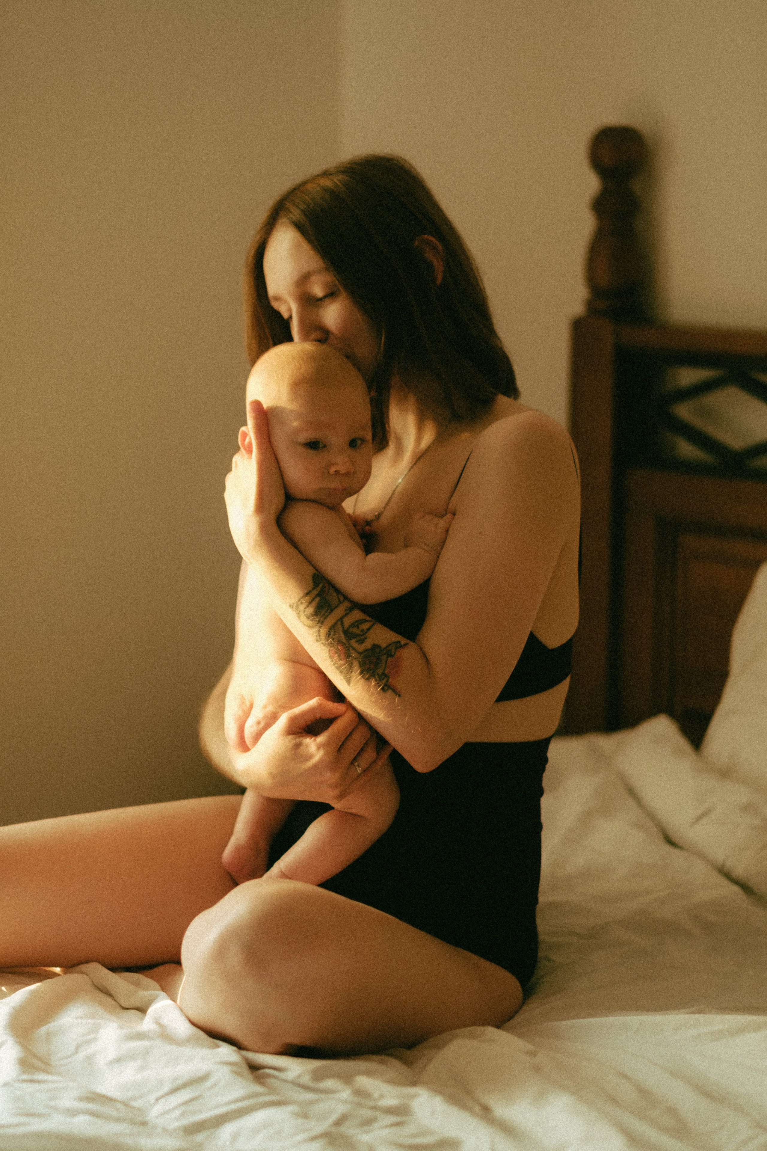 A heartfelt motherhood portrait capturing the delicate details and profound love between a mother and her baby in a natural, relaxed setting.