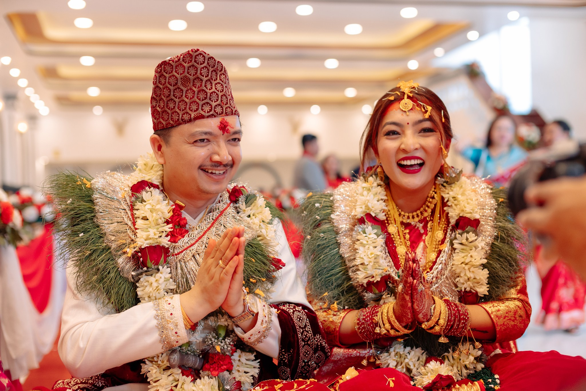 Happy Nepali wedding couple greeting guests during a traditional ceremony. Kathmandu Photography