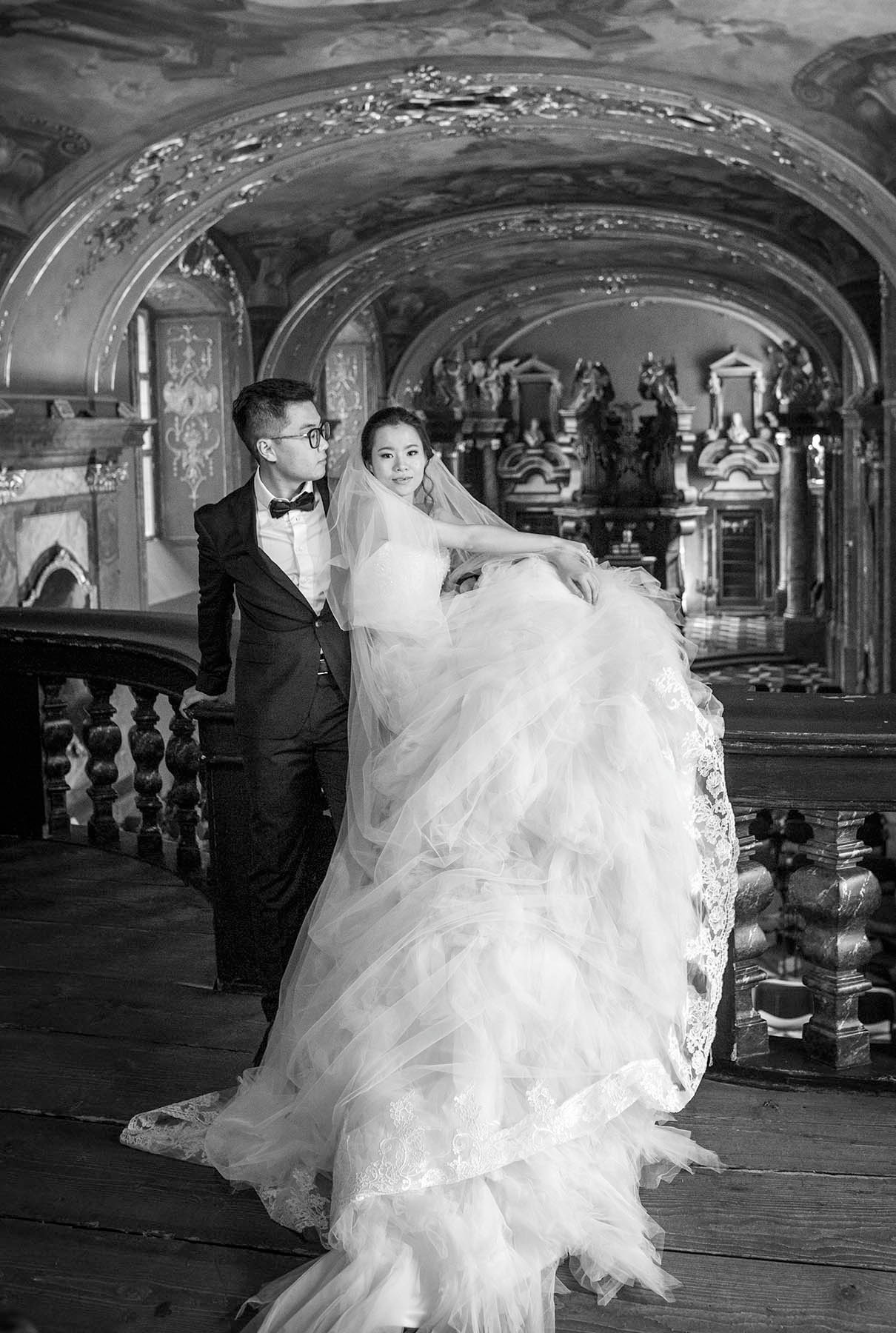 The newlyweds from China, Sean and Miranda, above the altar of the Klementinum Mirror Chapel in Prague