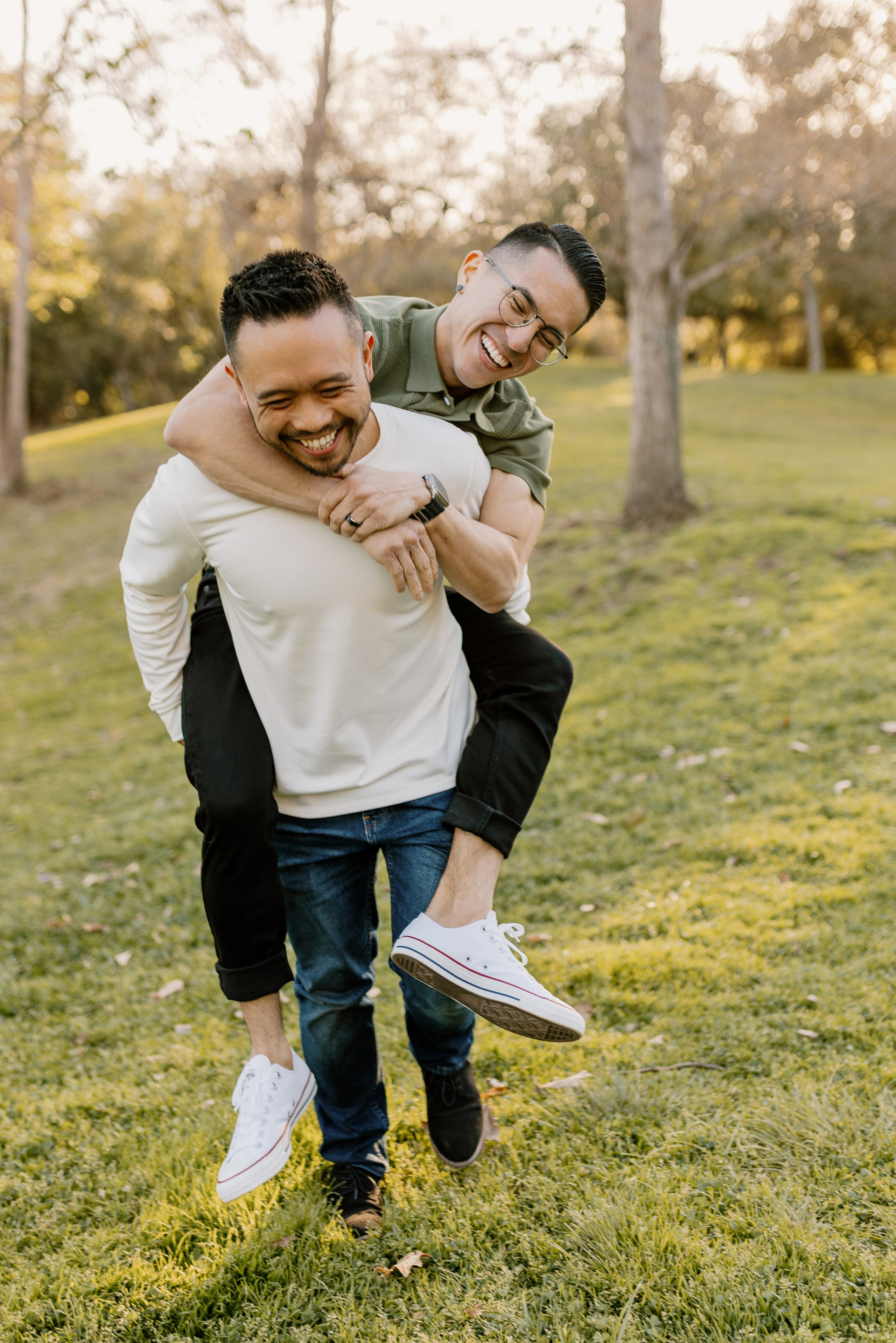 Engagement session gay couple having fun light and airy photo