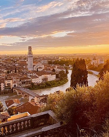 Couple walking hand in hand during surprise proposal planning session at Garda Lake, romantic engagement photography