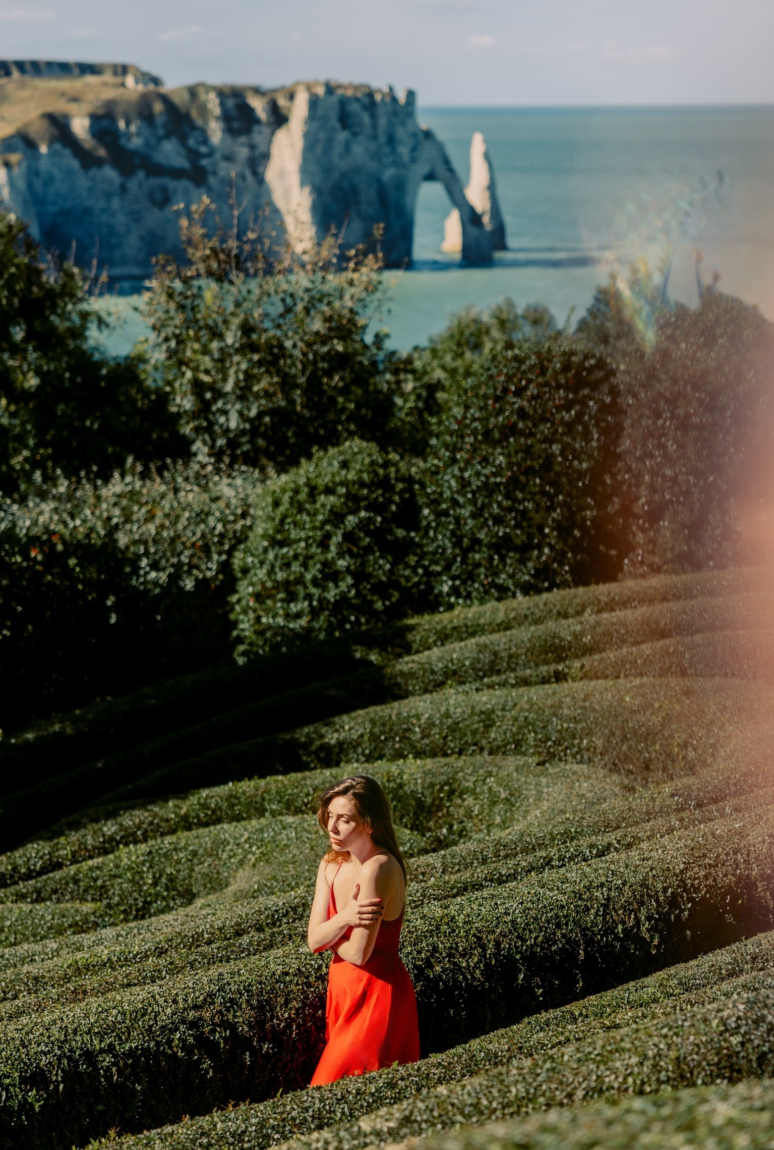 Dreamy Photoshoot in Étretat Gardens, France — Red Dress Portrait Session. Romantic & Soulful Photography by Natalia Olhova in Rotterdam