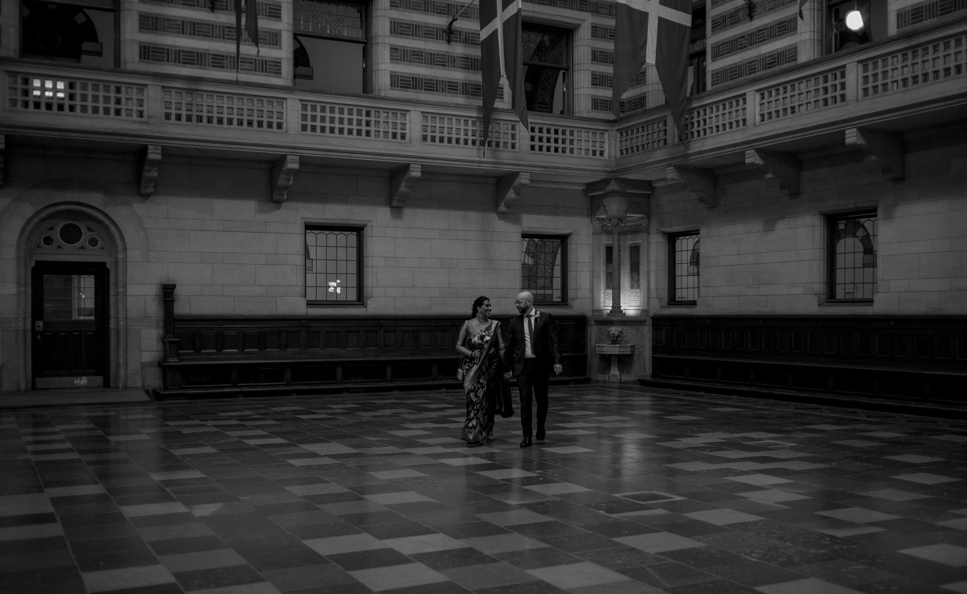 Romantic wedding moment in the grand halls of City Hall