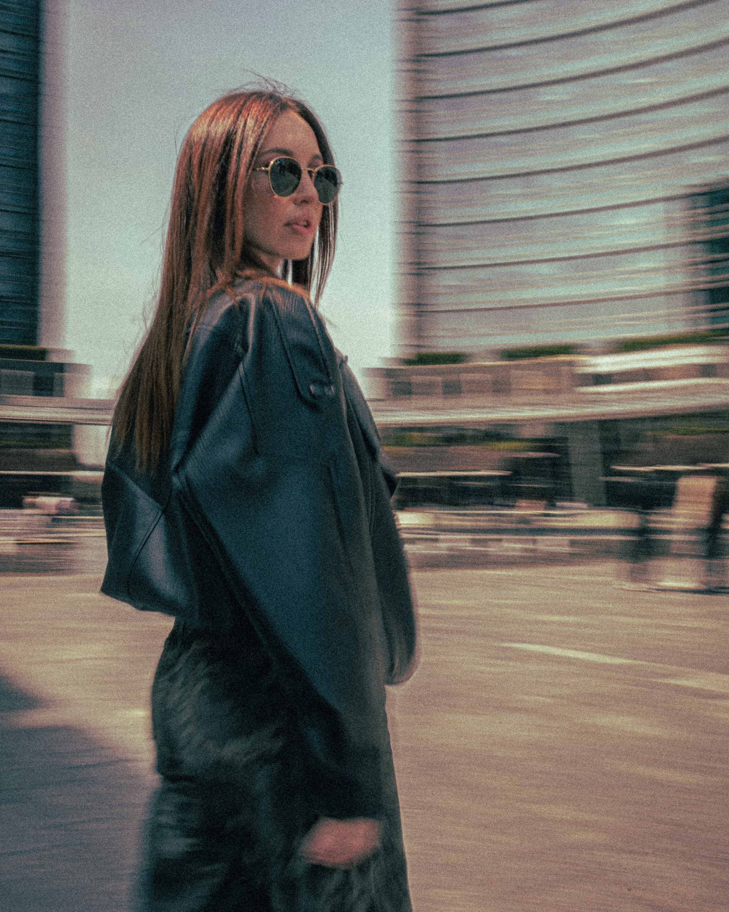 Editorial portrait of a woman with motion blur in Milan