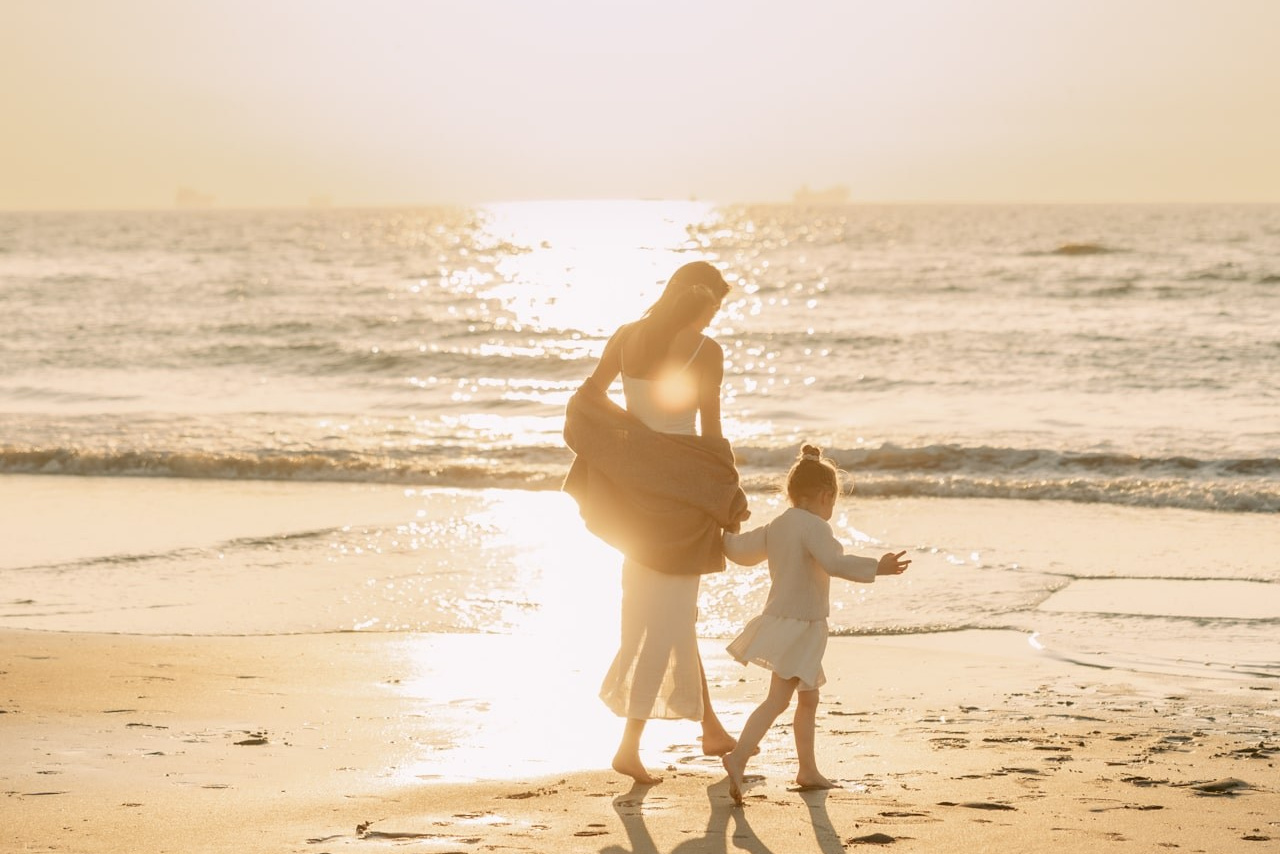 Mother and child at sunset beach photoshoot in the Netherlands