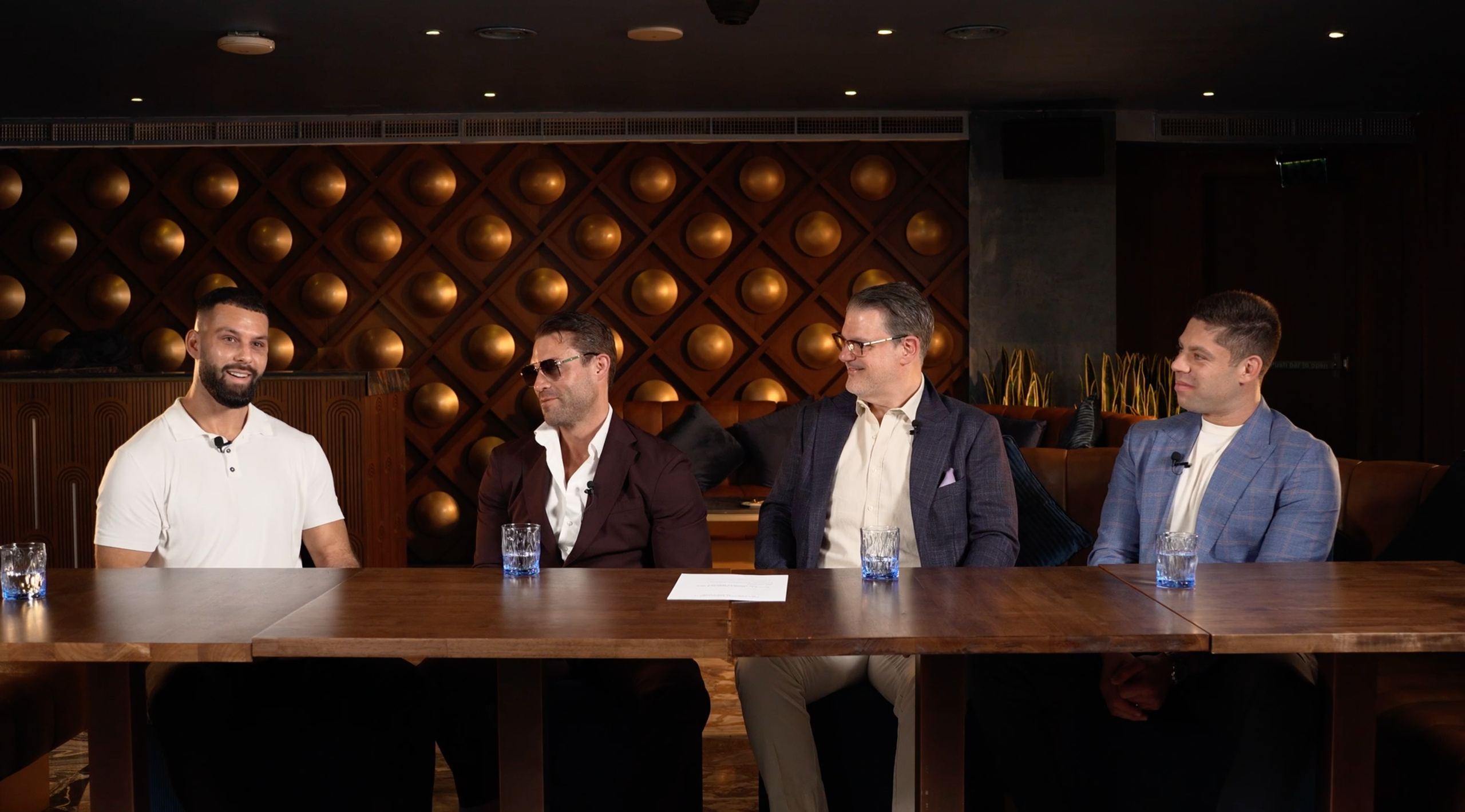 Four business professionals taking part in a roundtable video podcast recorded on location in Dubai