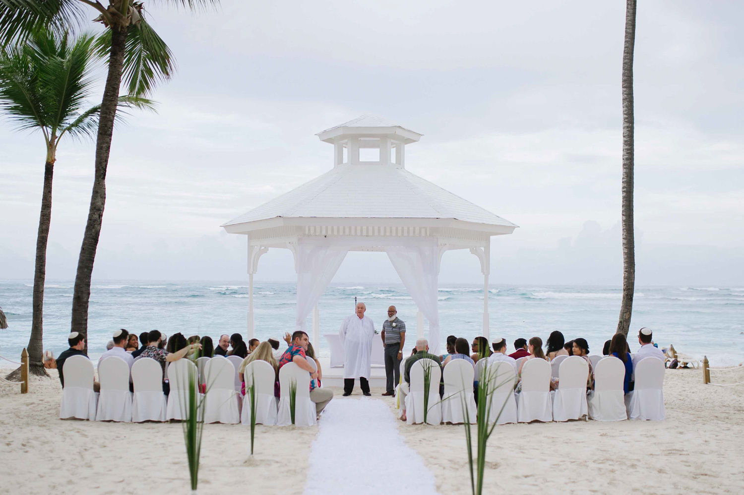 The start of the wedding ceremony near the ocean at the Majestic Colonial Hotel.