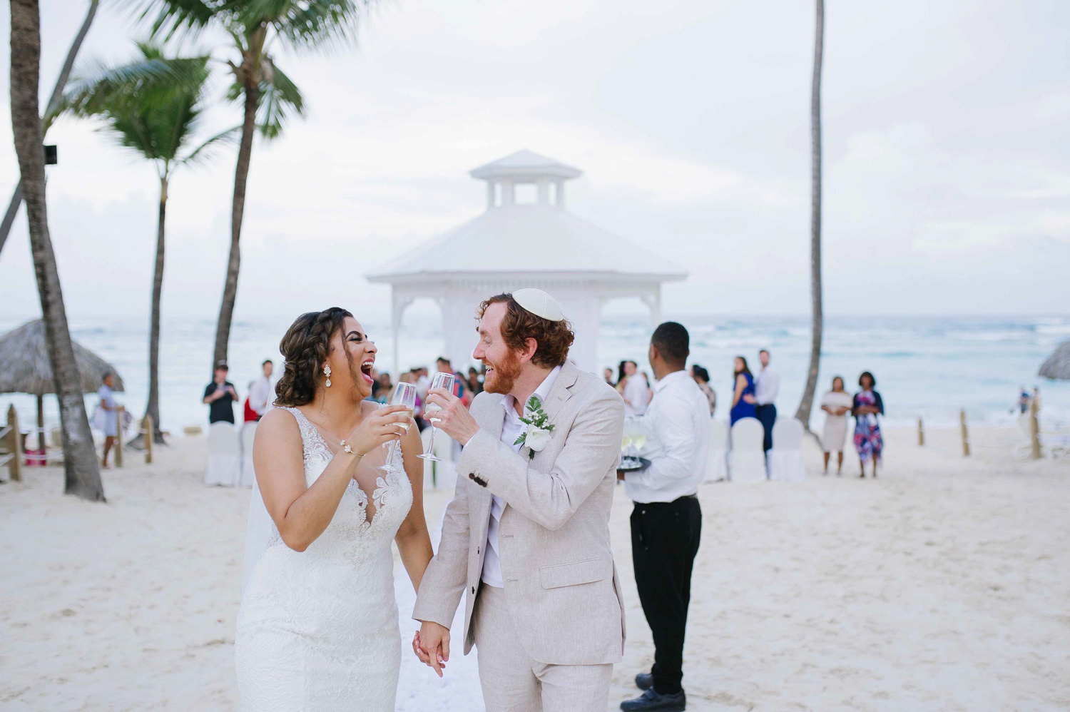The bride and groom walk hand in hand after the ceremony.