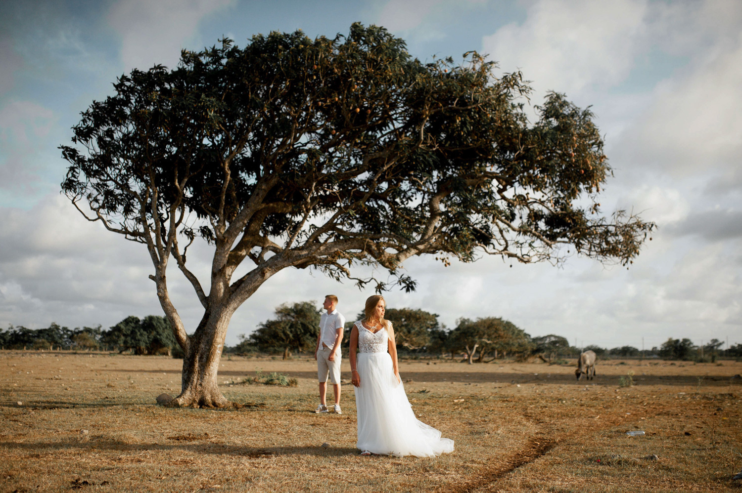 The bride and groom pose for a picture.