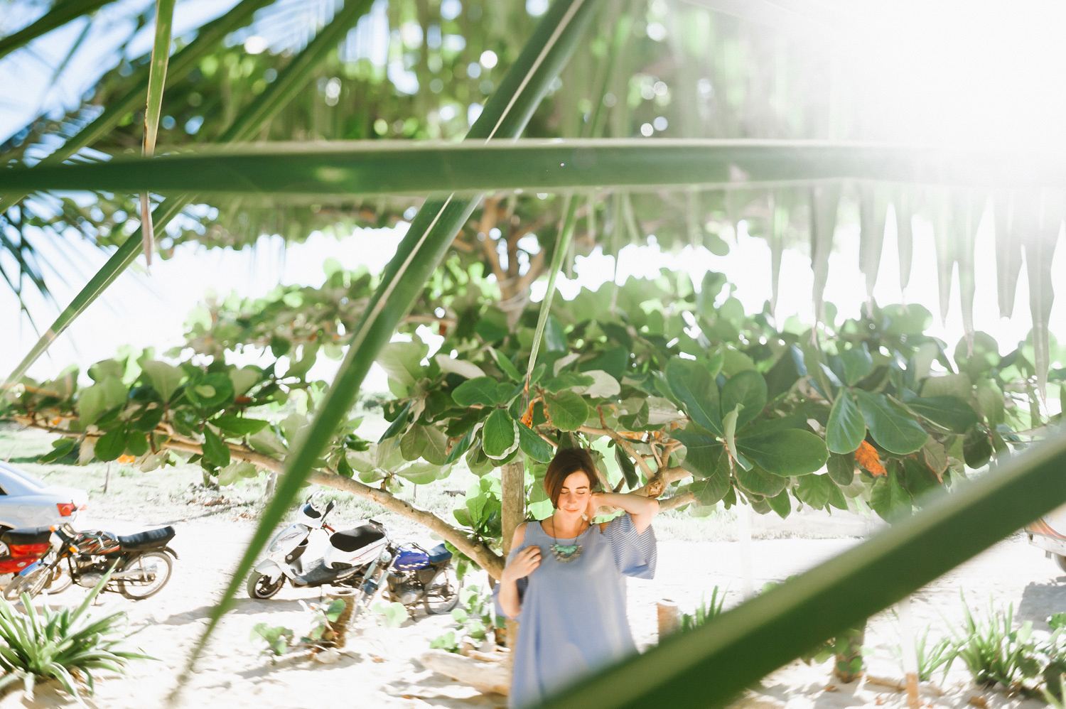 The bride is wearing a blue dress and posing for a picture.