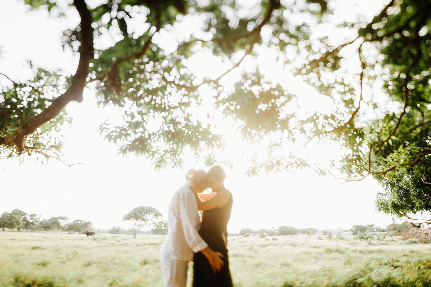 The newlyweds hug each other.