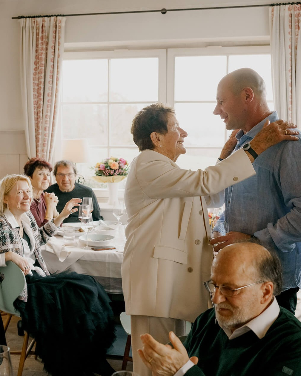 amily and friends celebrating together at a private event in a cozy apartment in Munich