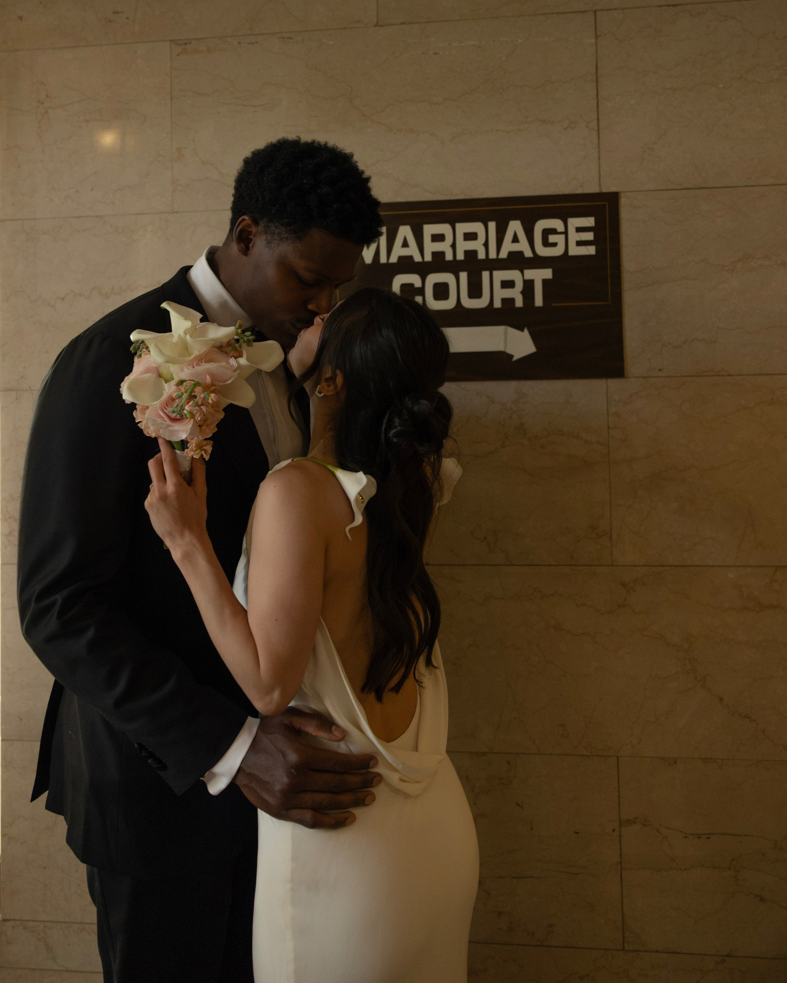 Bride walking down elegant staircase during intimate wedding in Chicago