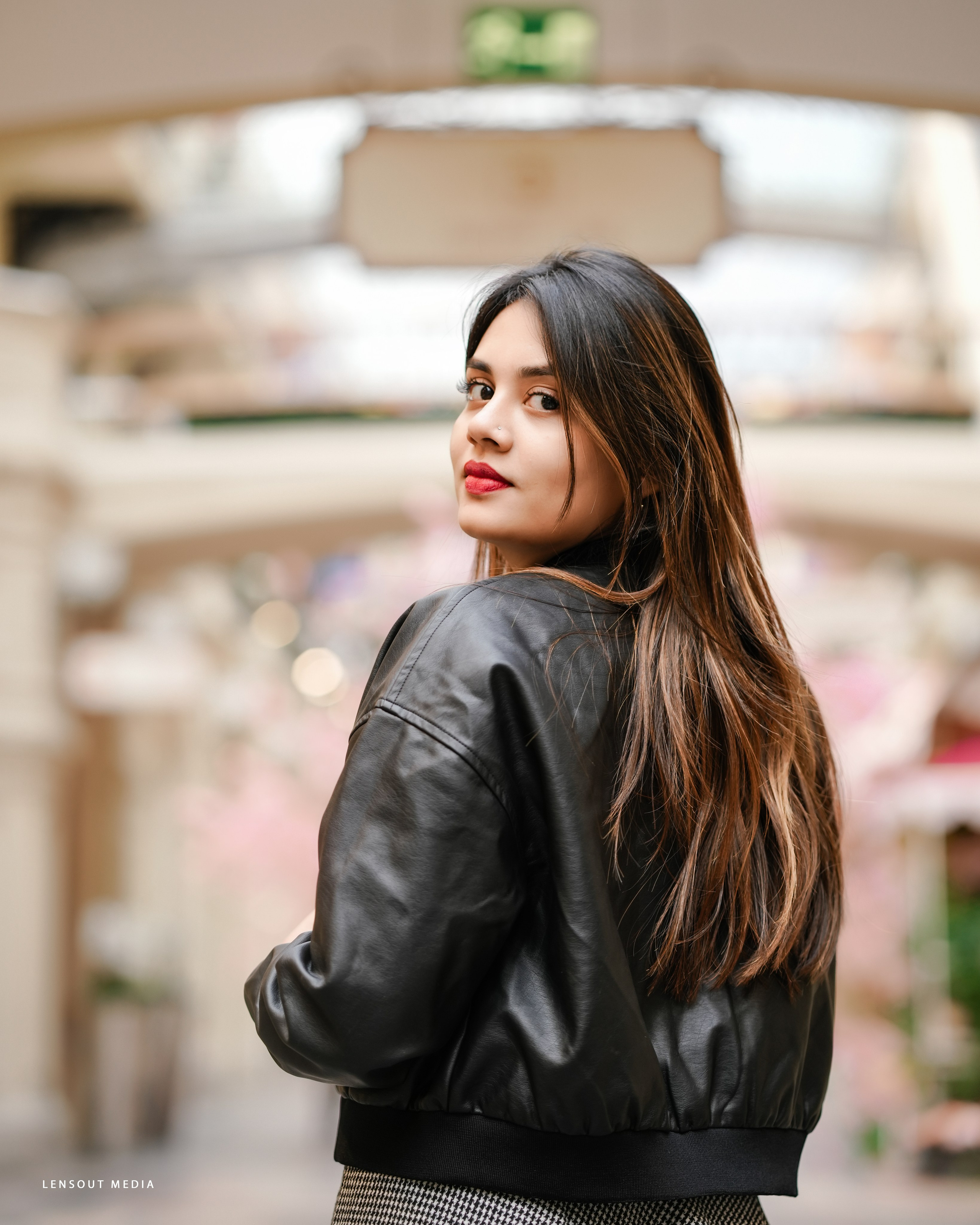 Beautiful portrait of Jasmine Jafr in black jacket.