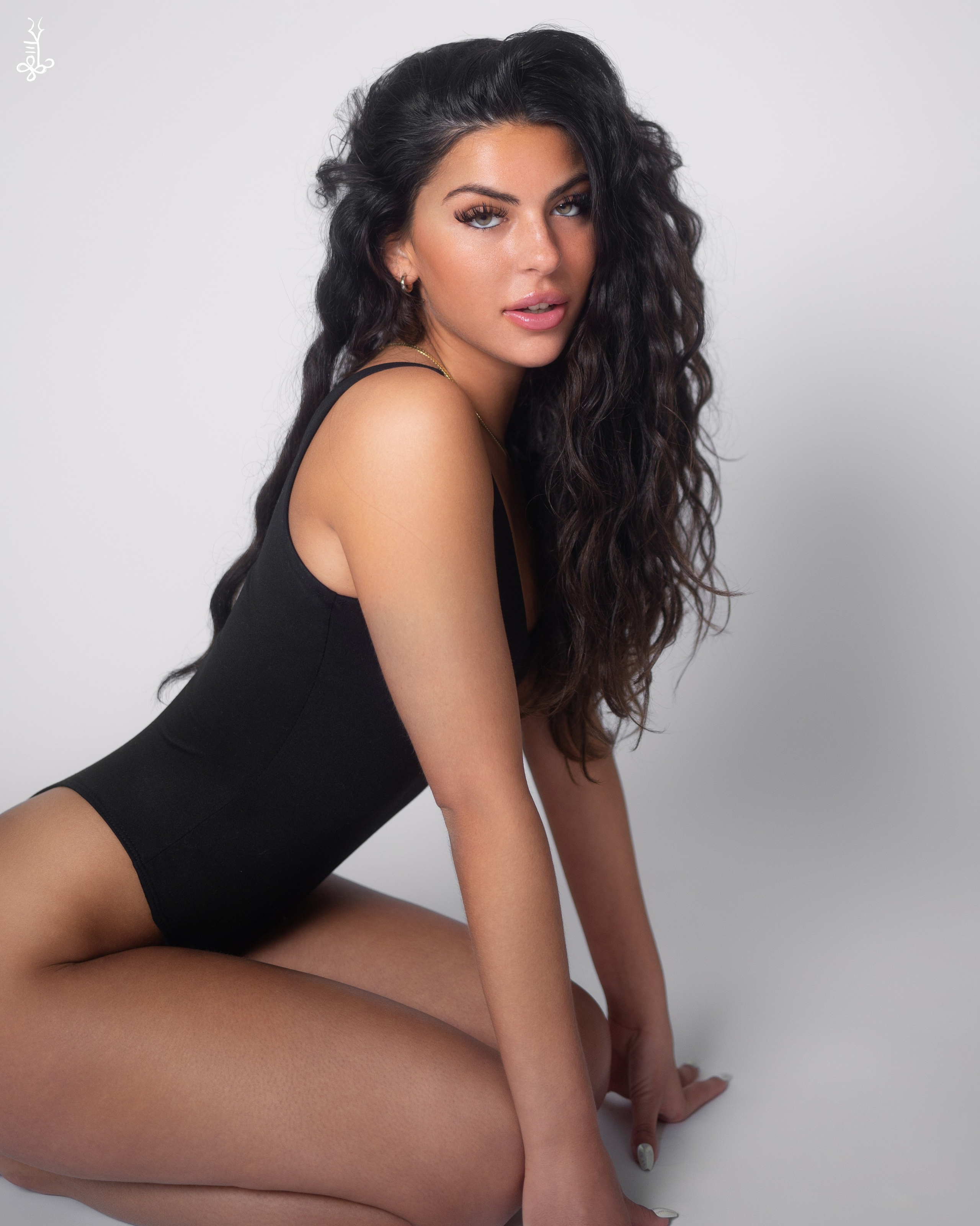 Jade Syan sitting on a rock