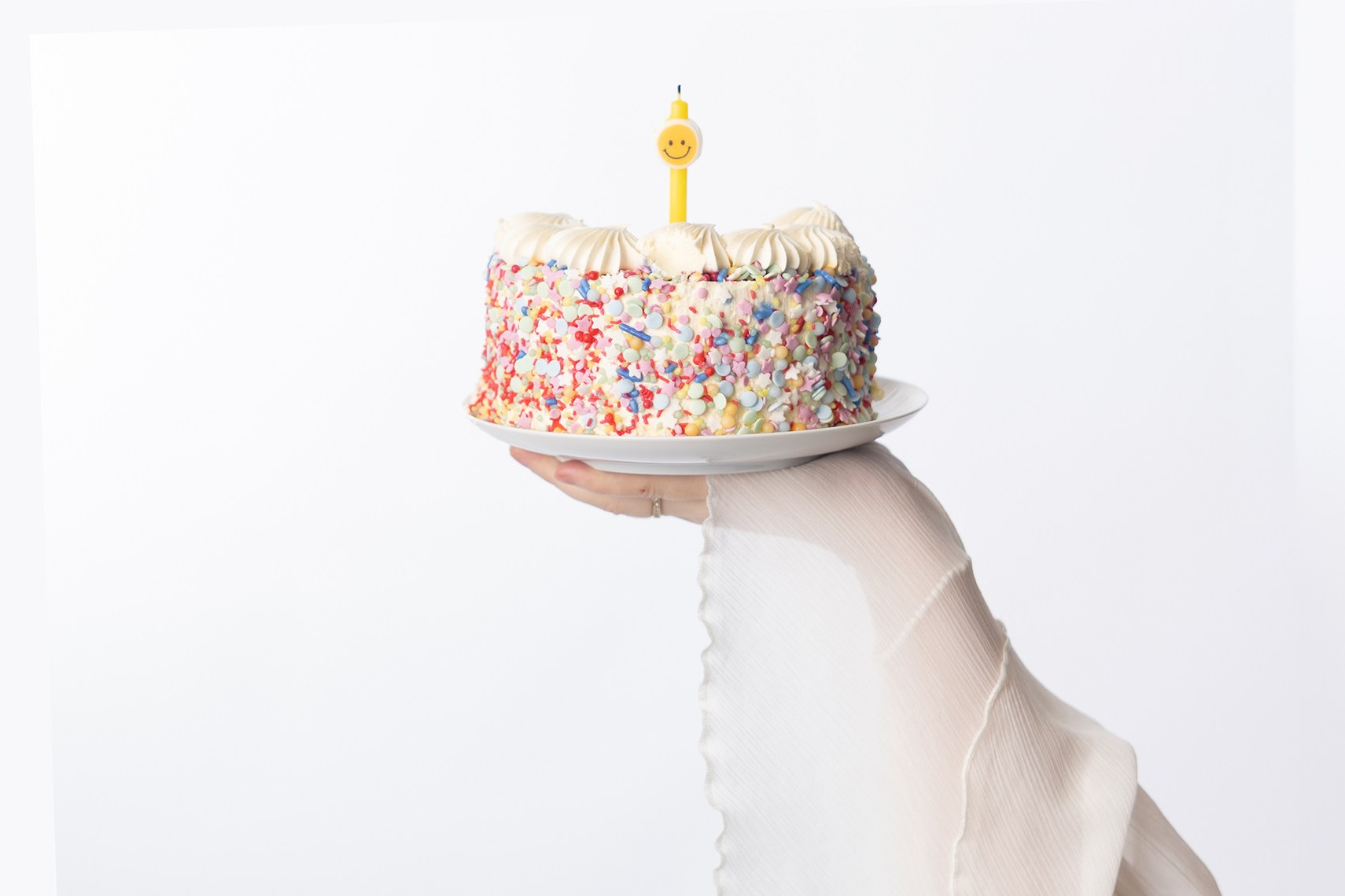 Romantic outdoor table with roses and fruit in warm tones