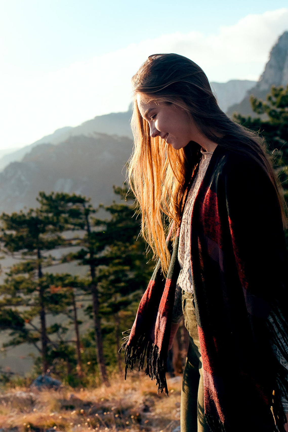 Woman walking in the mountains during golden hour