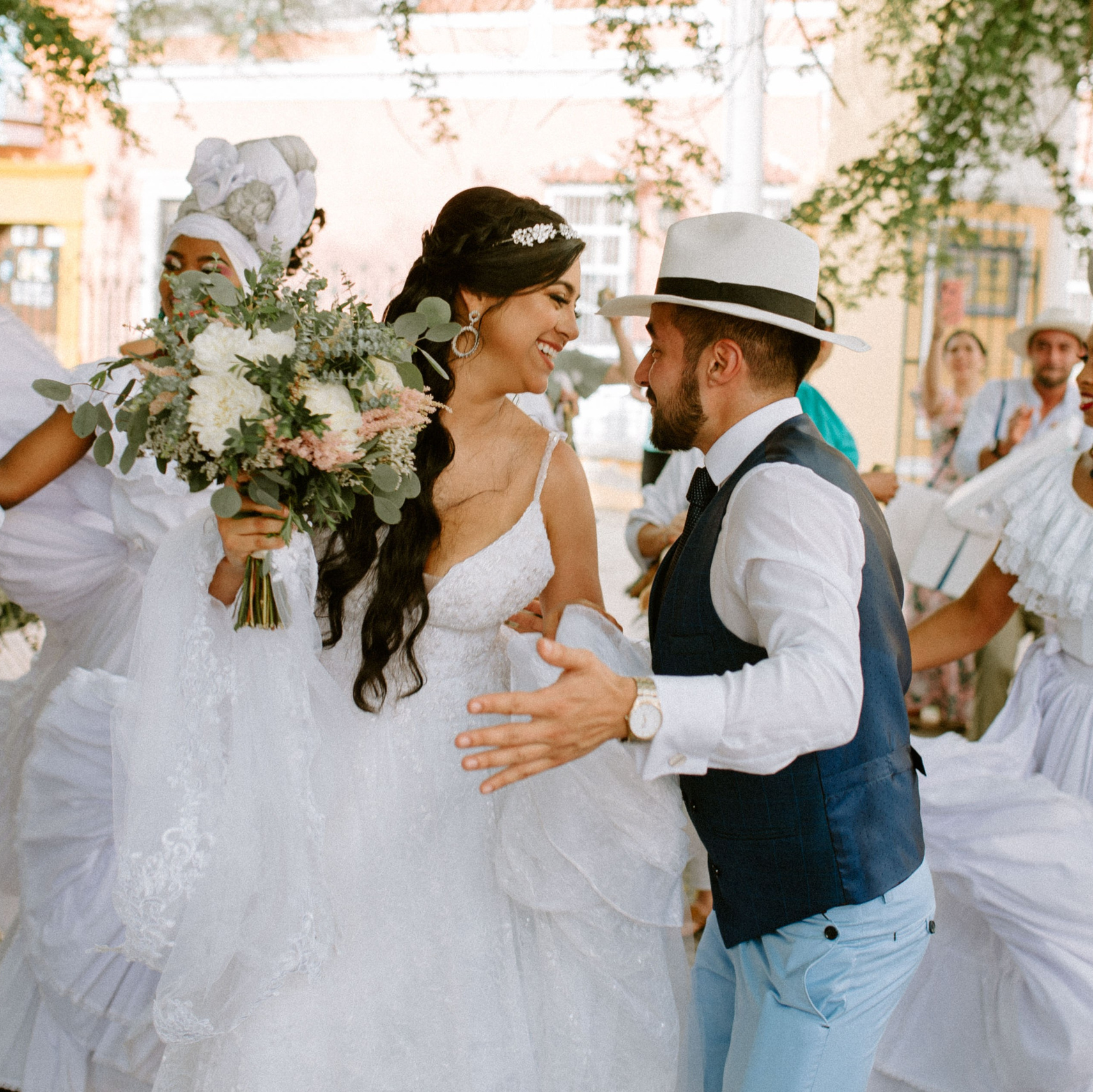 Brides celebrating together – “Group of brides celebrating and laughing together outdoors in Cartagena, joyful wedding photography