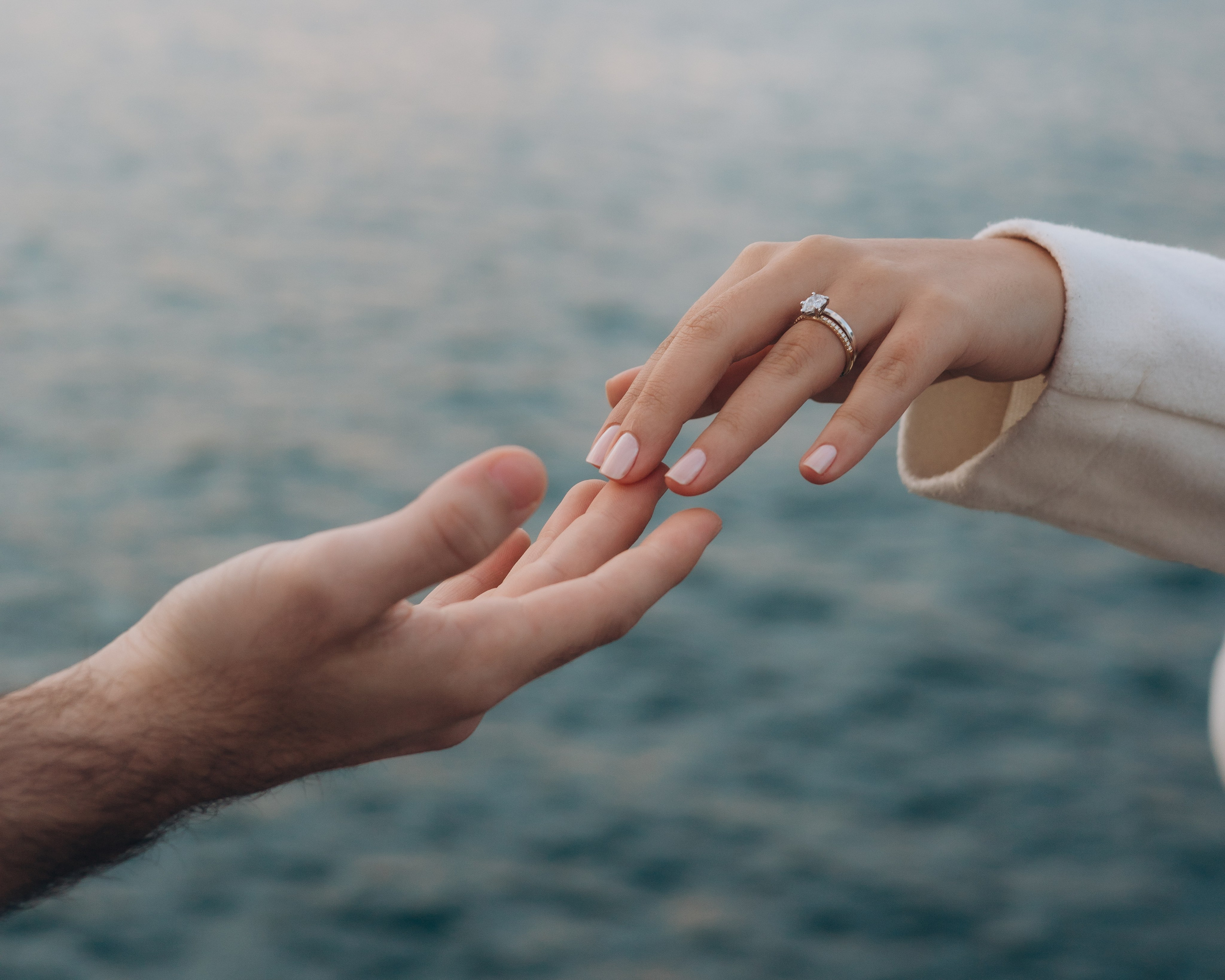 Close-up of a couple’s hands with an engagement ring after a proposal in Chicago