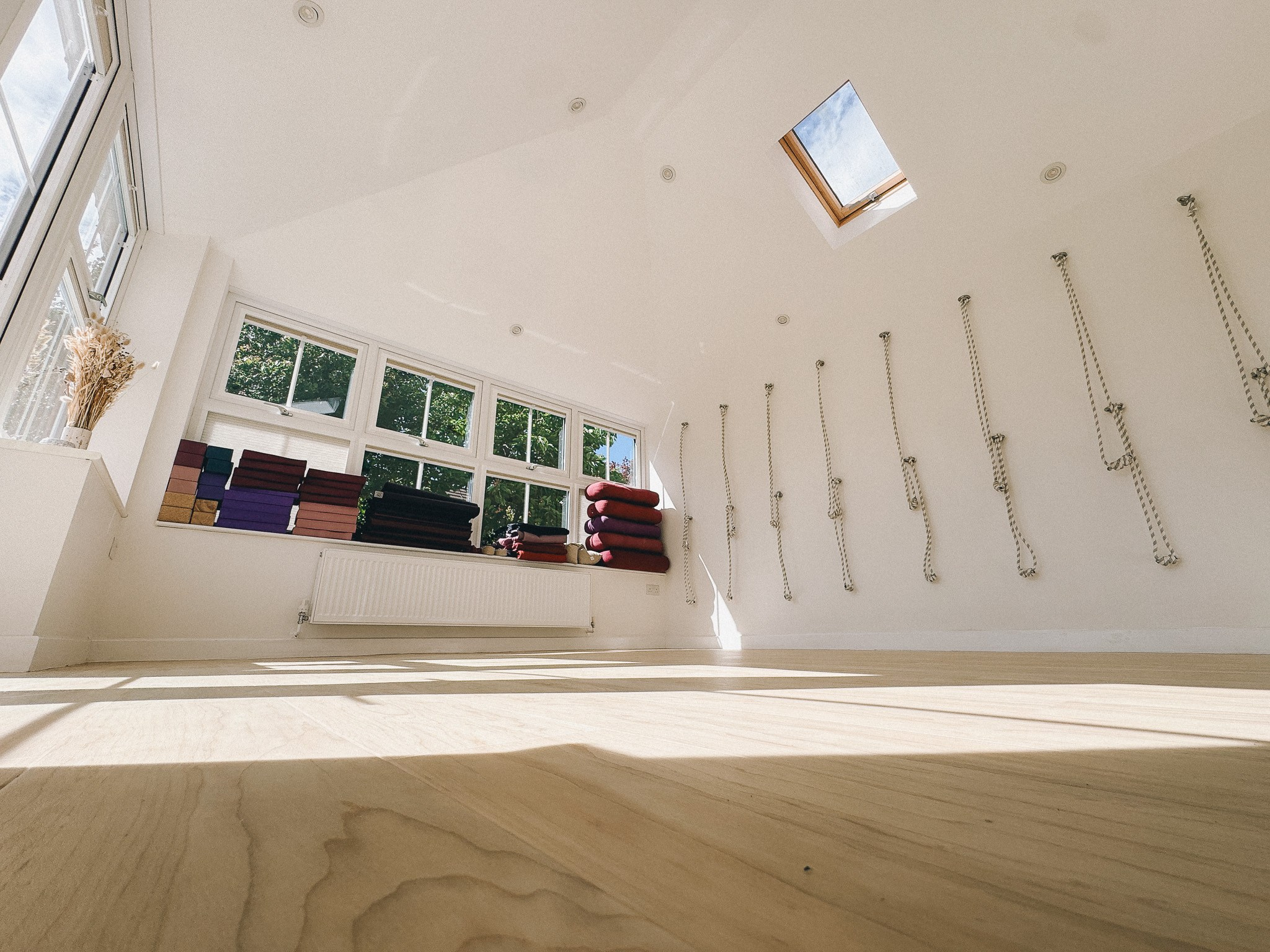 Iyengar yoga studio in Solihull with wall ropes, props, and open practice space for private lessons